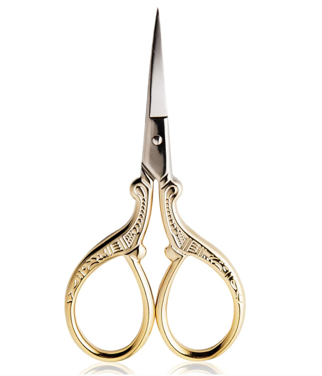 A pair of small, ornate embroidery scissors with gold-colored handles and sharp steel blades.