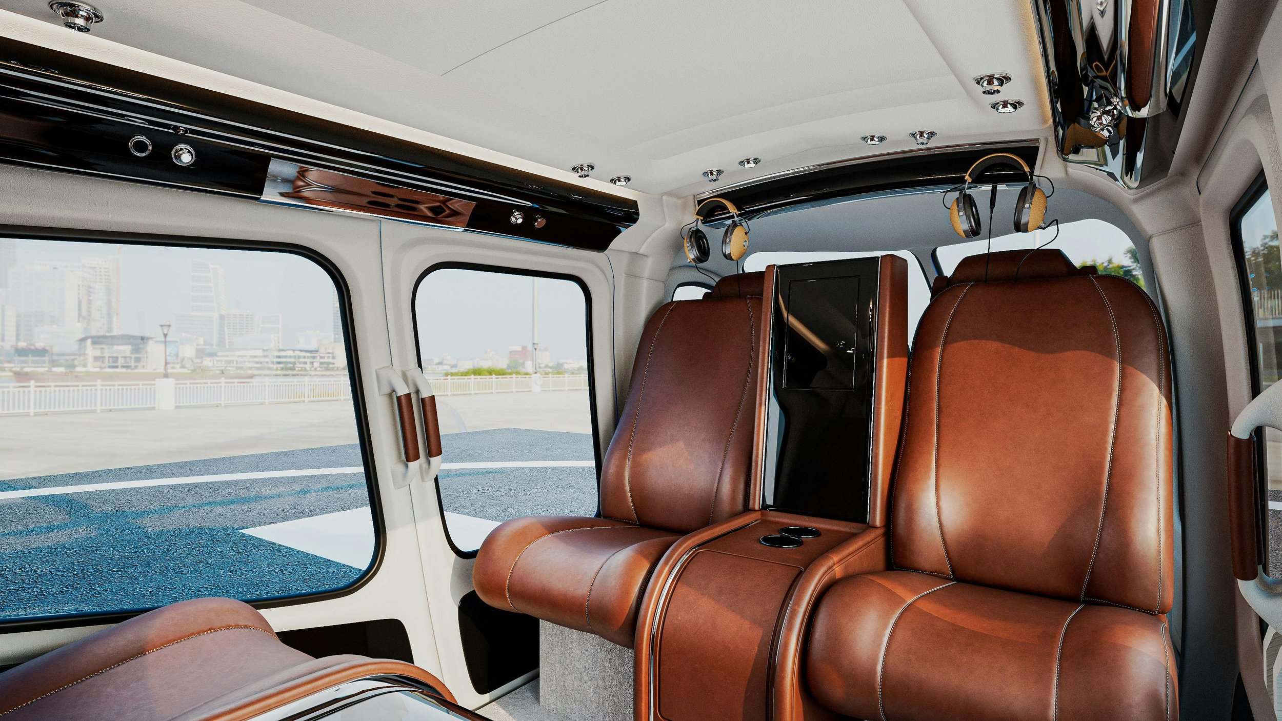 Inside a helicopter with brown leather seats, large windows, and headphones hanging above the seats, showing an urban landscape outside.