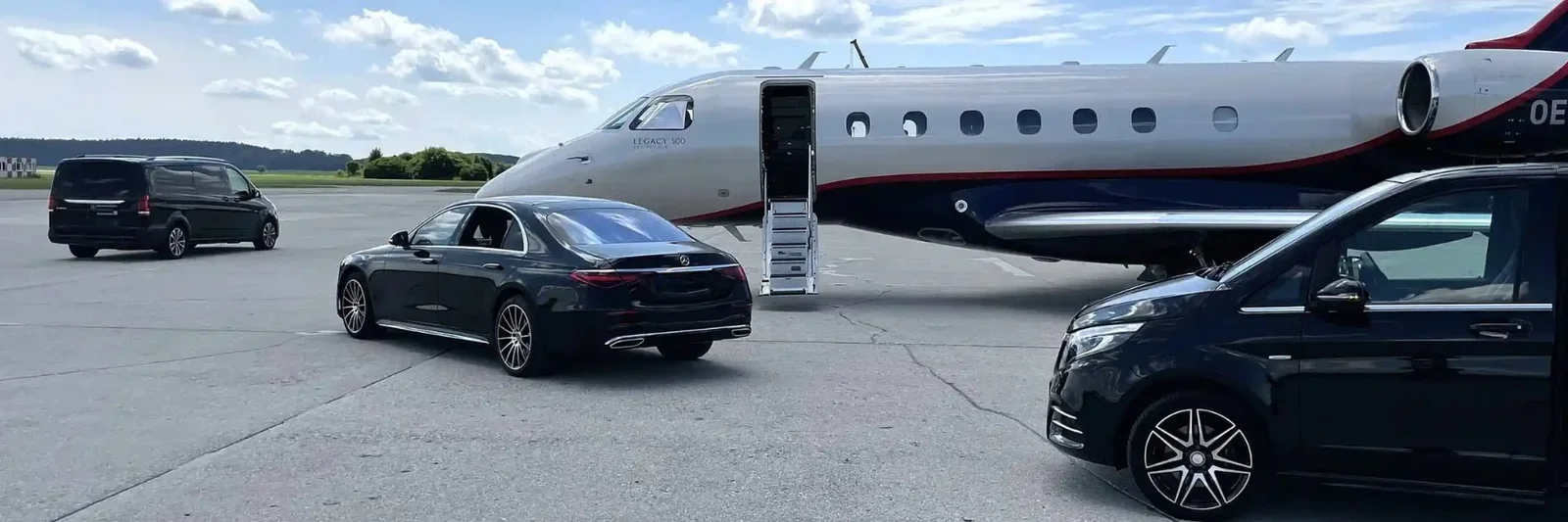 Black Car Mercedes S-Class and Mercedes V-Class and a private jet on an airport tarmac