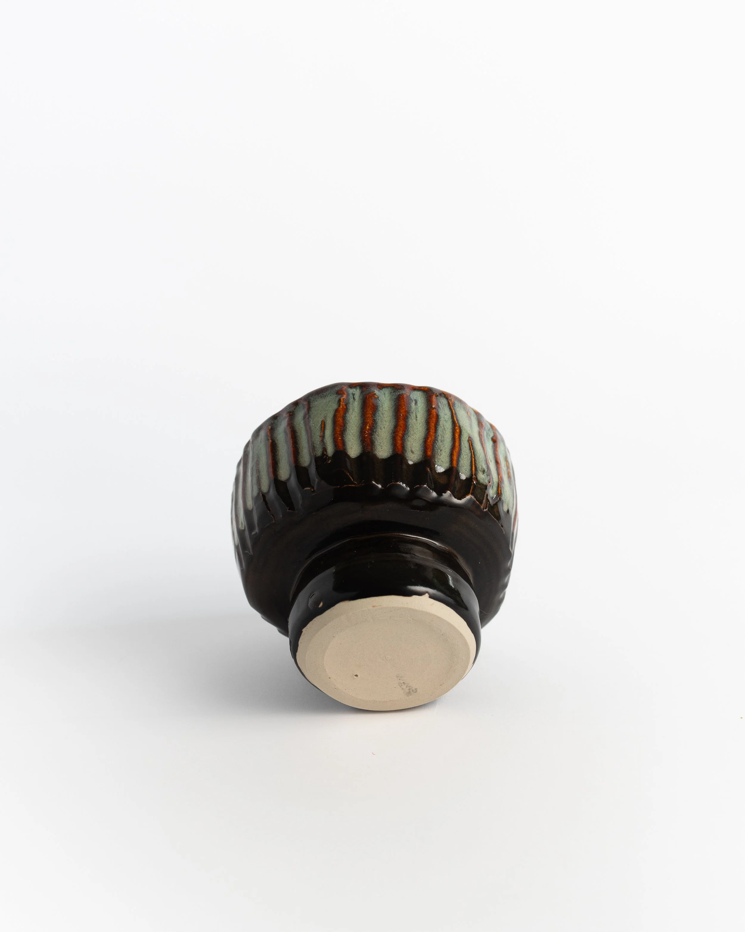 Underside of Rattle Bowl showing the unglazed foot and maker's mark.