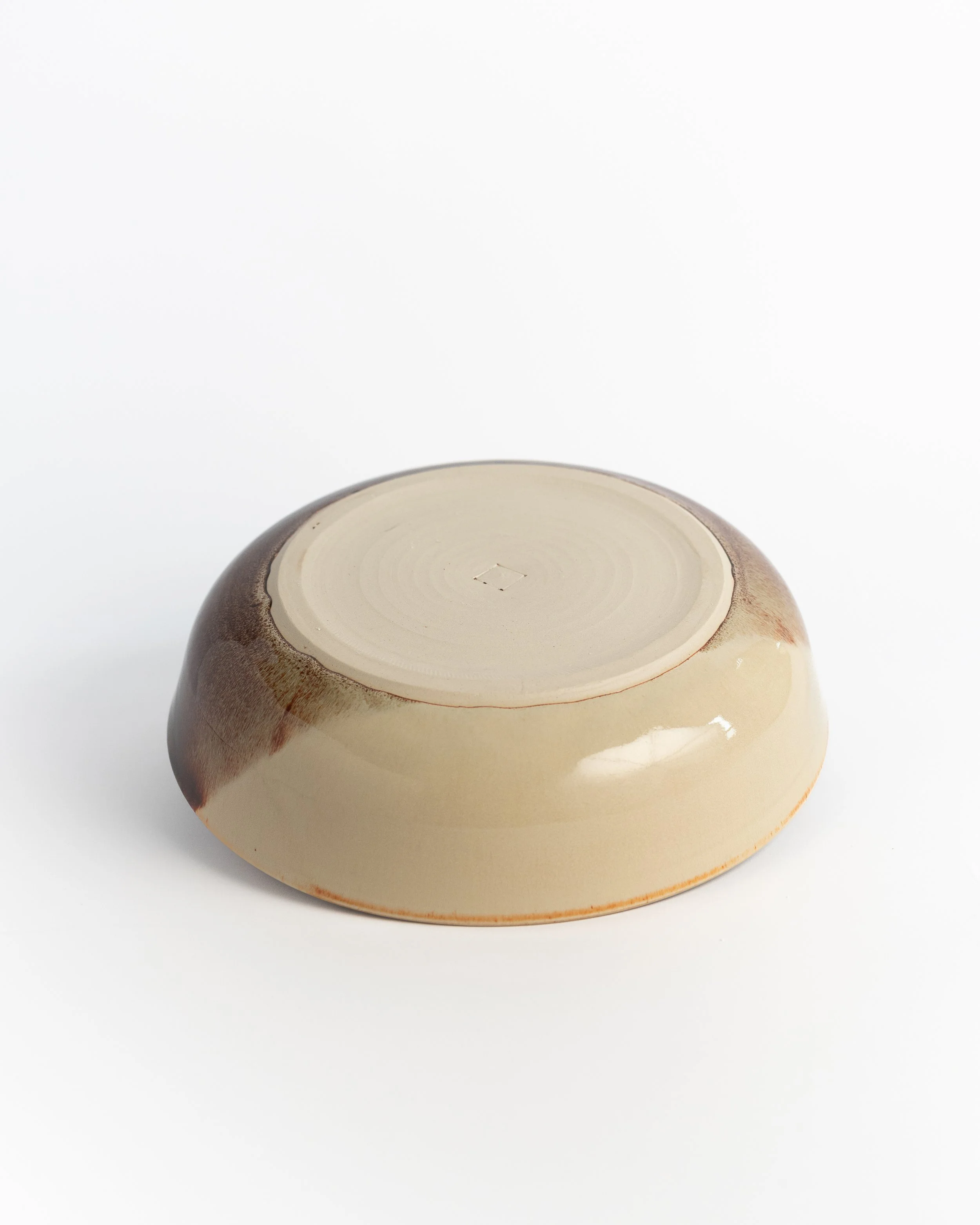 Underside of Tortoiseshell Bowl showing the unglazed foot and maker's mark.