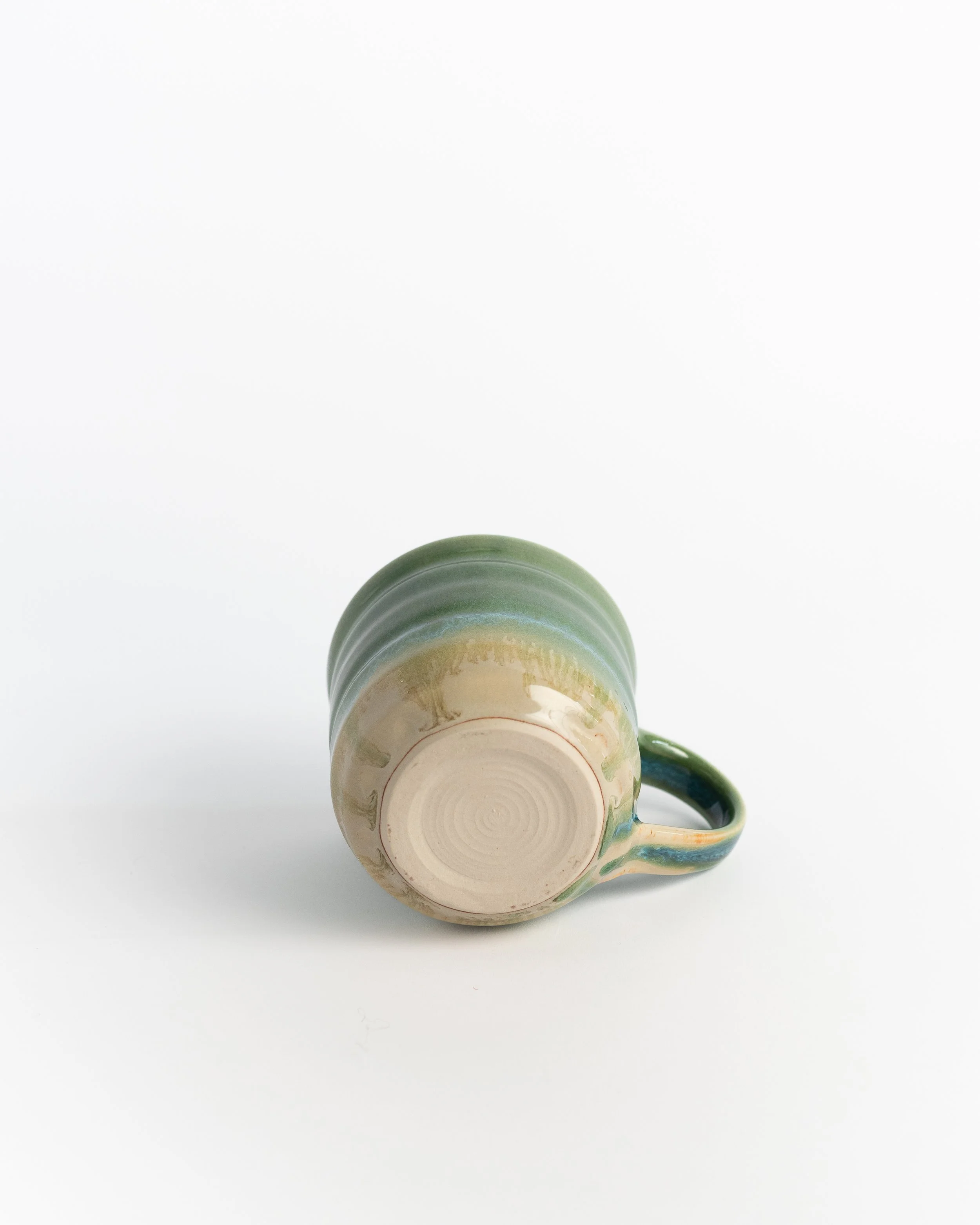 Underside of Verdant II showing the unglazed foot and maker's mark.