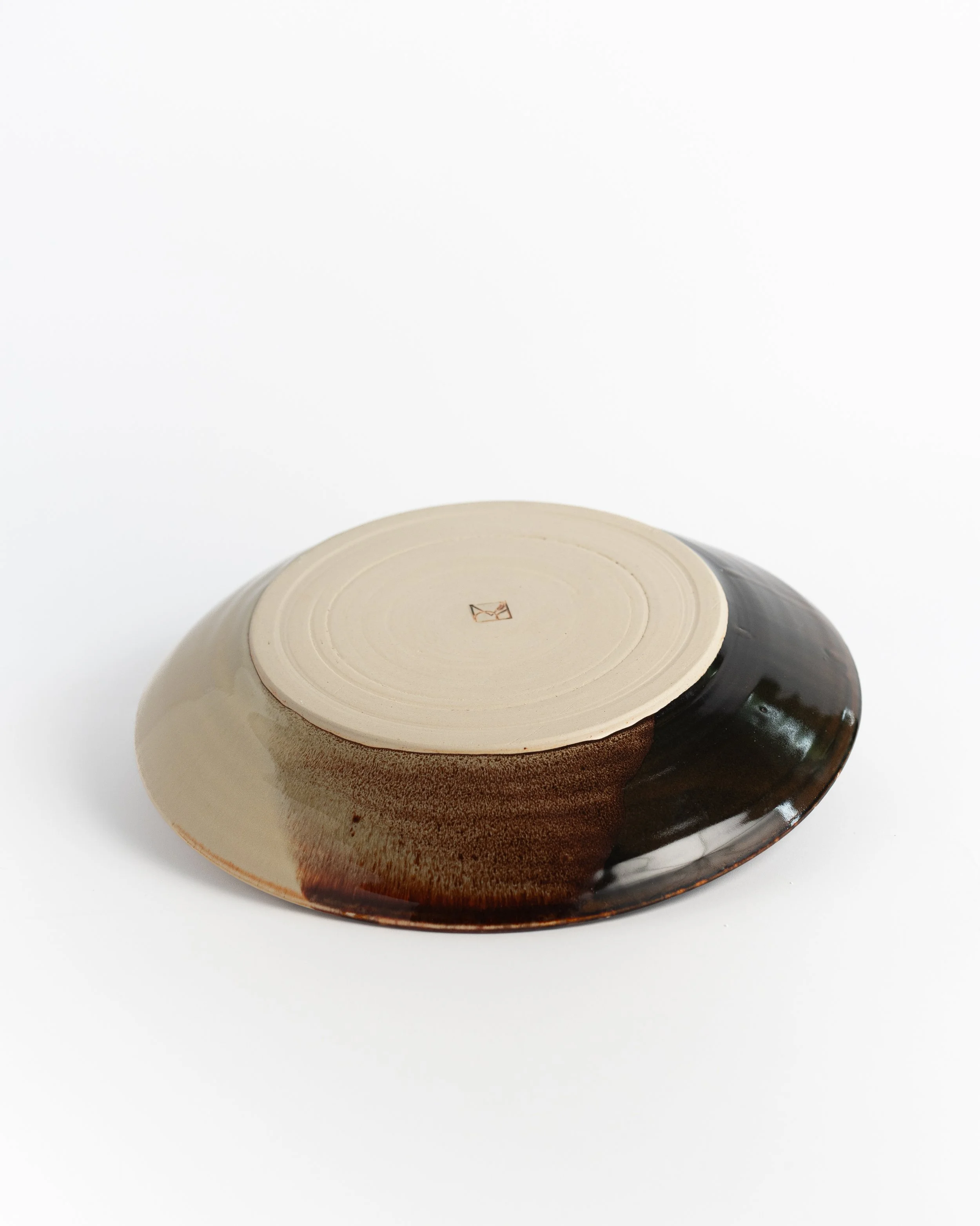 Underside of Tortoiseshell Plate showing the unglazed foot and maker's mark.