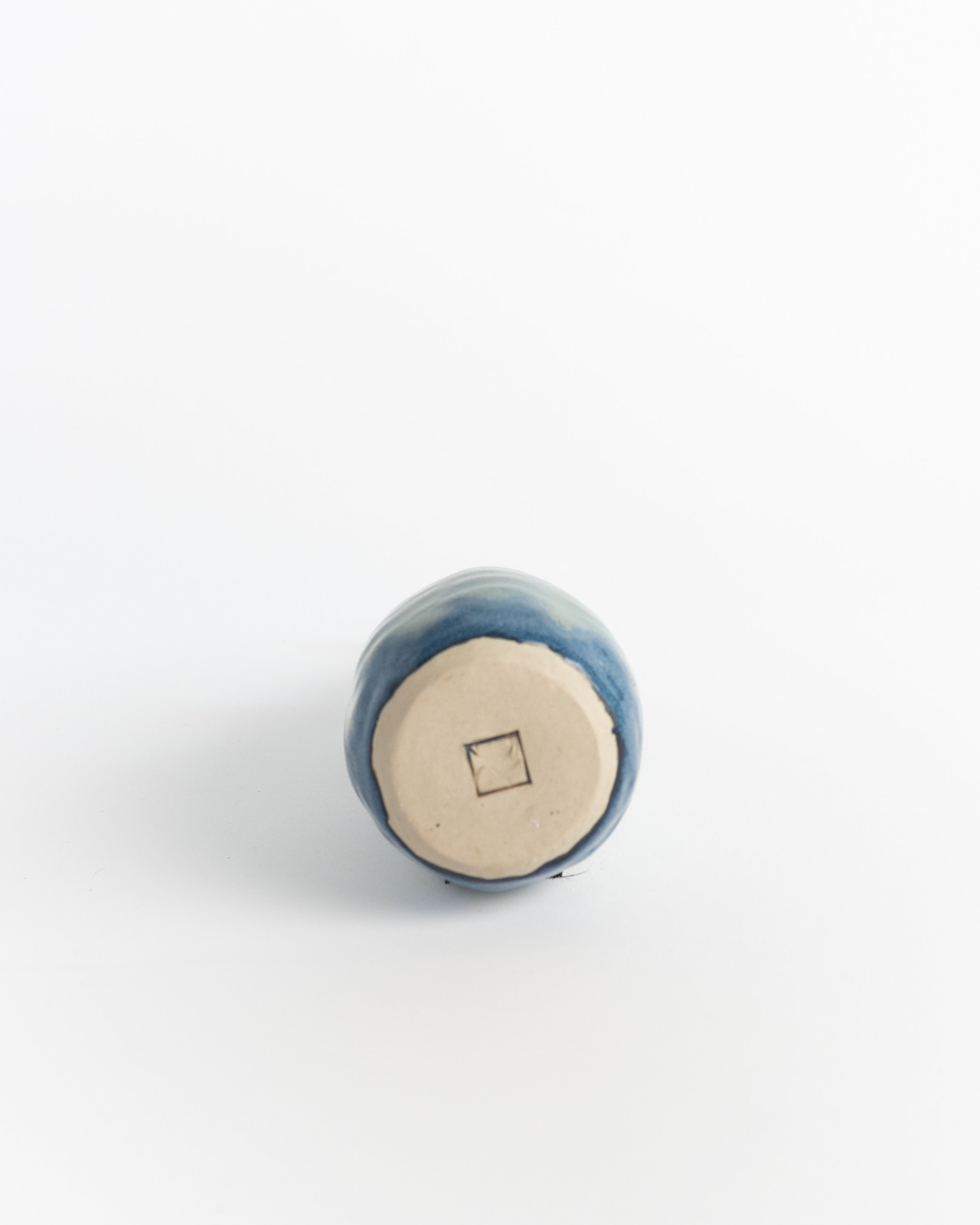 Underside of Sea Glass Cruet showing the unglazed foot and maker's mark.