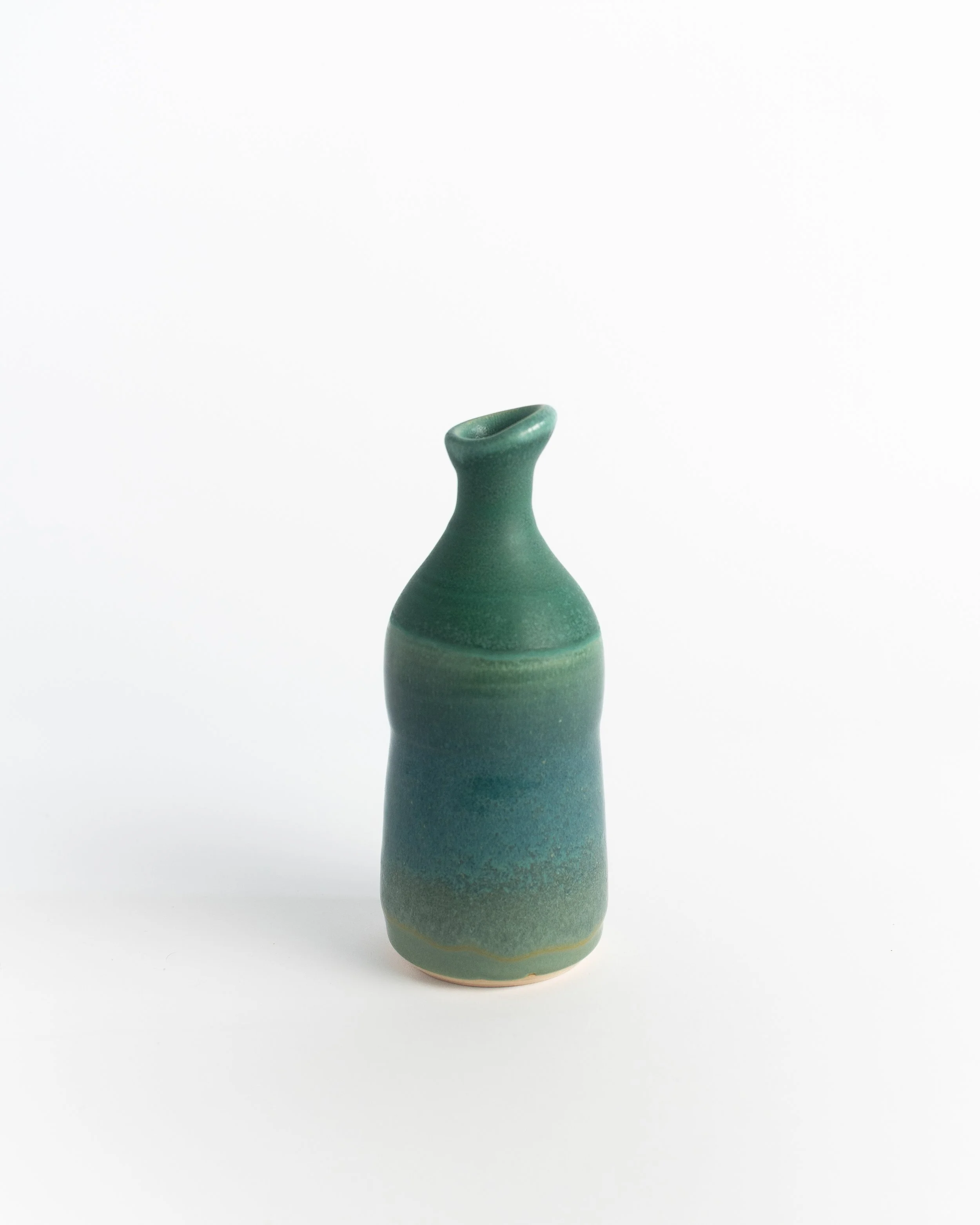 Ceramic bottle vase in soft teal with a flared lip and gentle throwing rings.