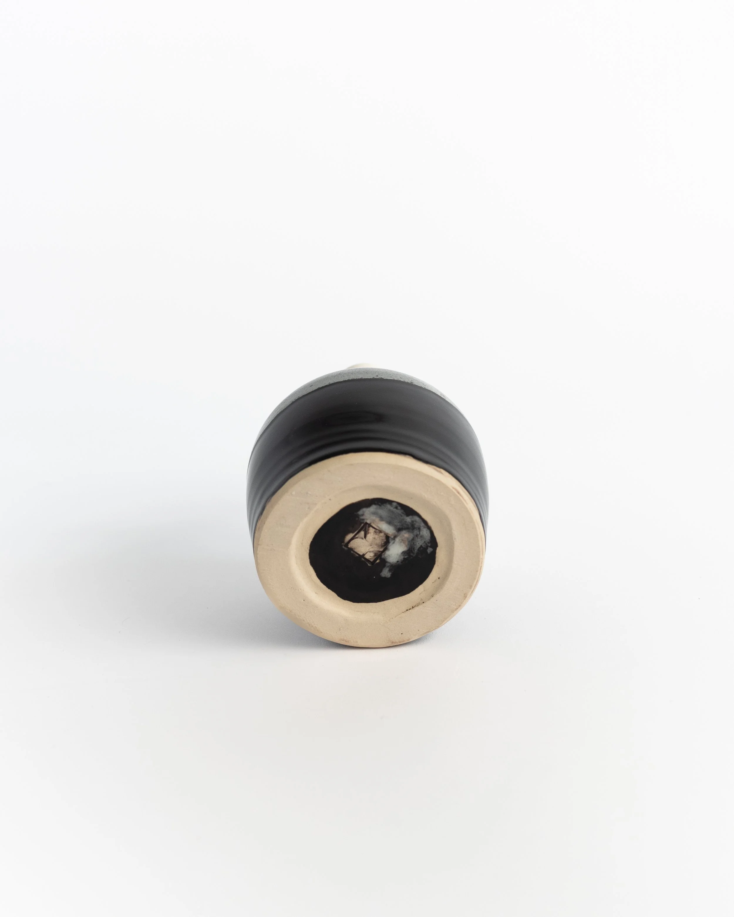 Underside of Ink Dip Bud Vase showing the unglazed foot and maker's mark.