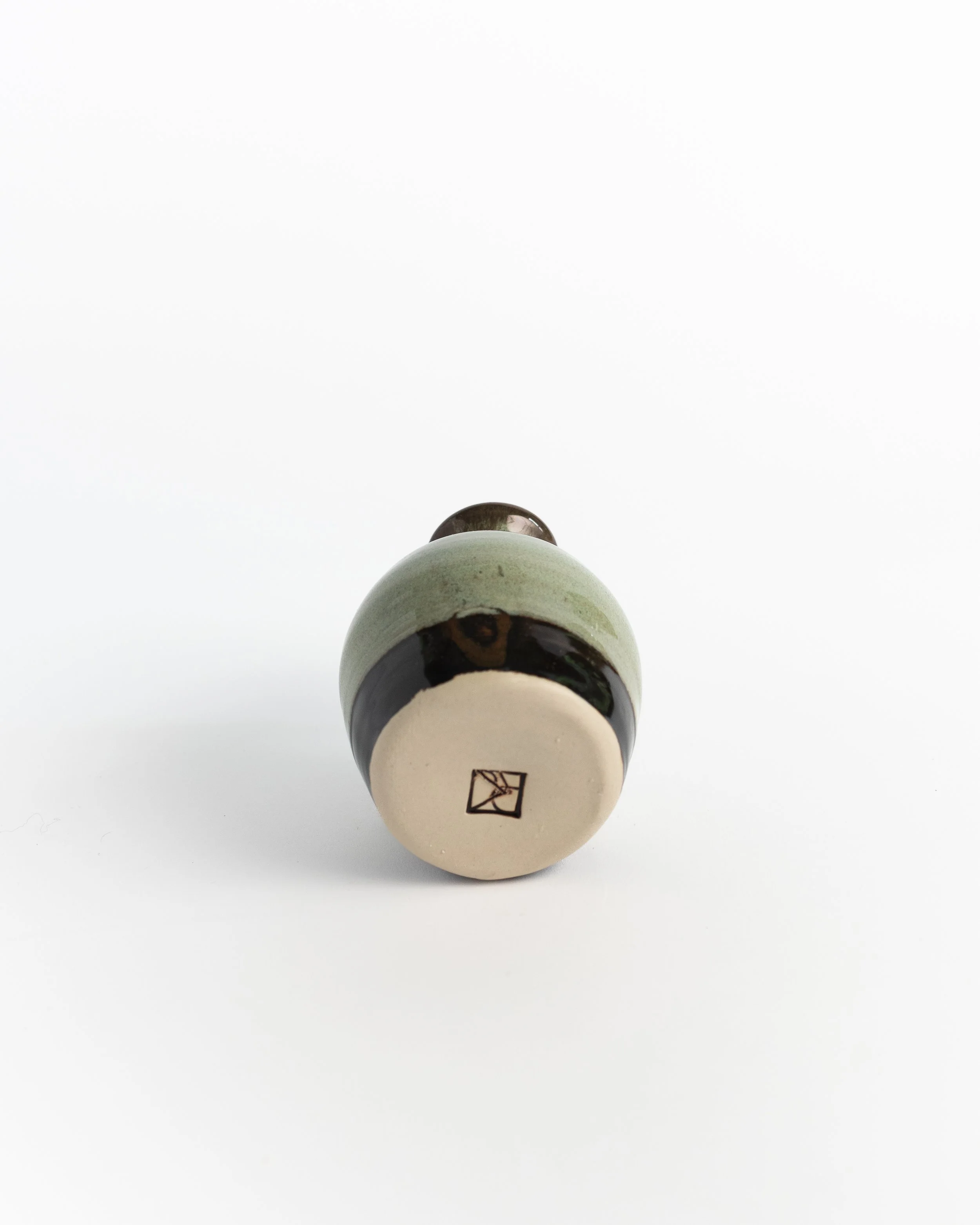 Underside of Moss Corked Bottle showing the unglazed foot and maker's mark.