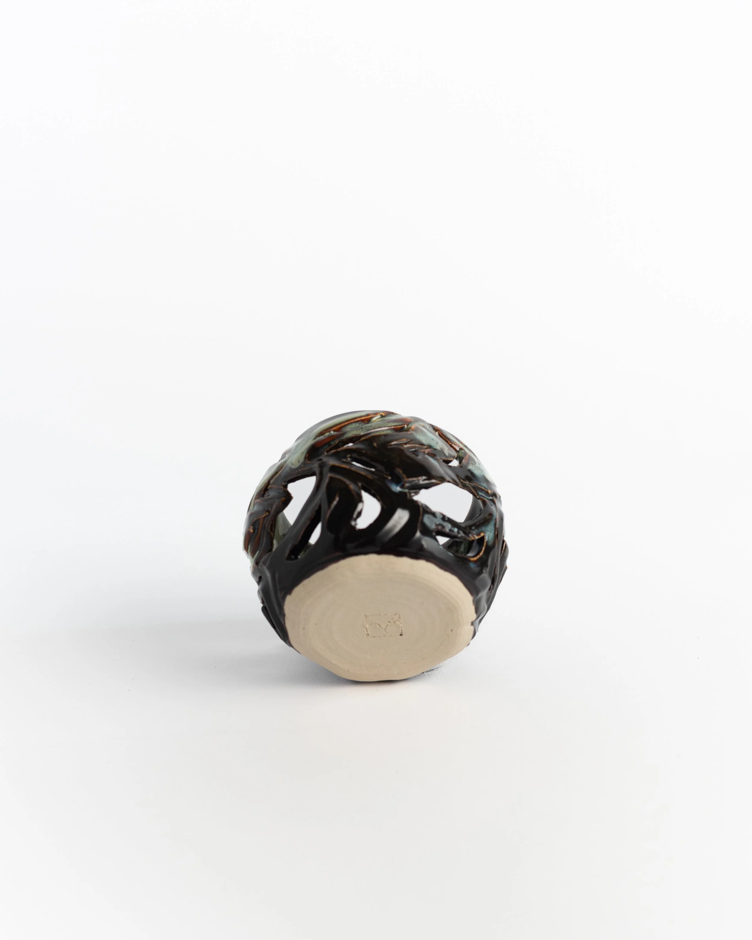 Underside of Lantern Votive showing the unglazed foot and maker's mark.