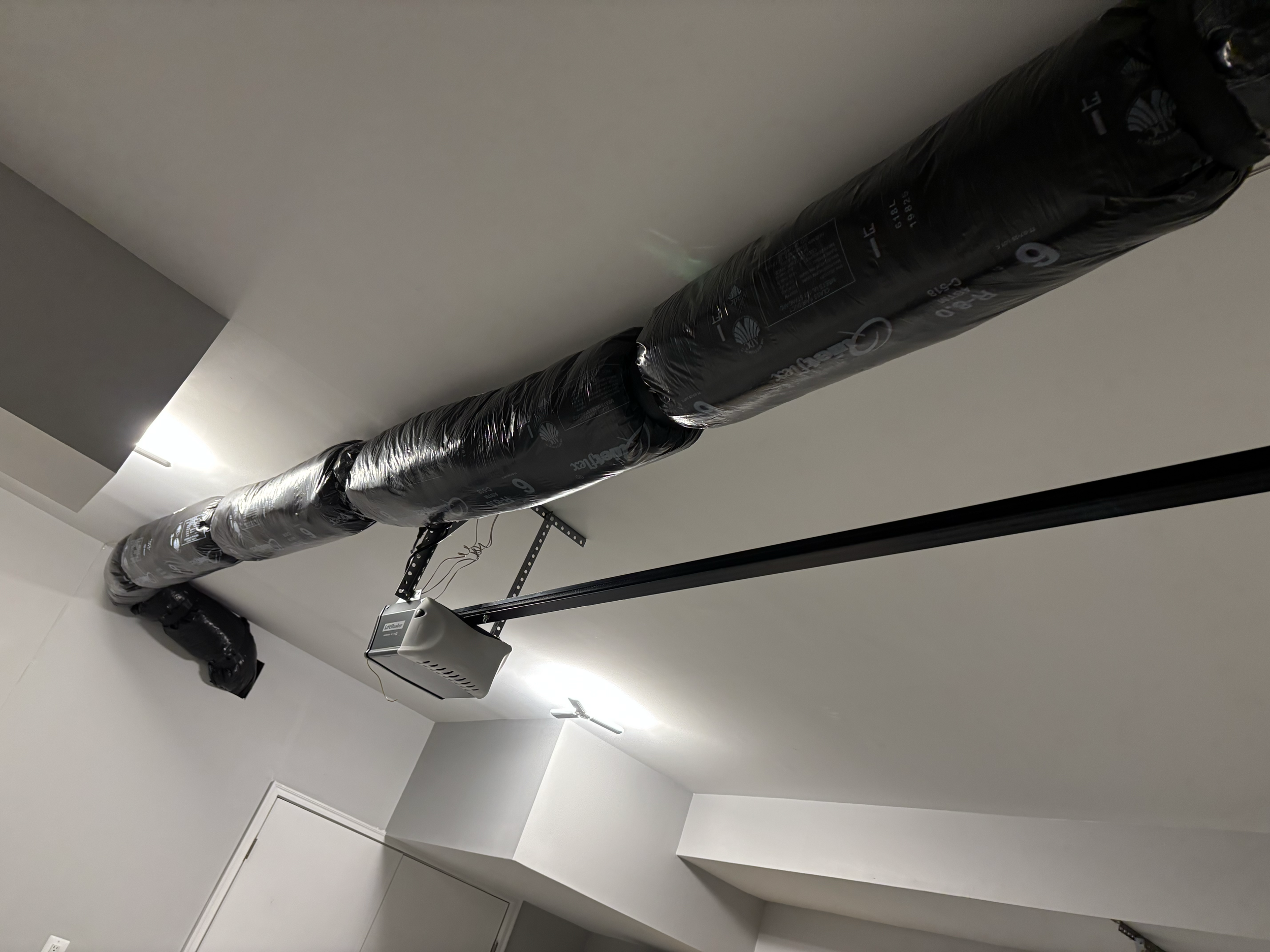 Additional ductwork needed to be installed in the lower level with an exit through the garage.