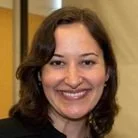 A woman with shoulder-length dark hair smiling at the camera.