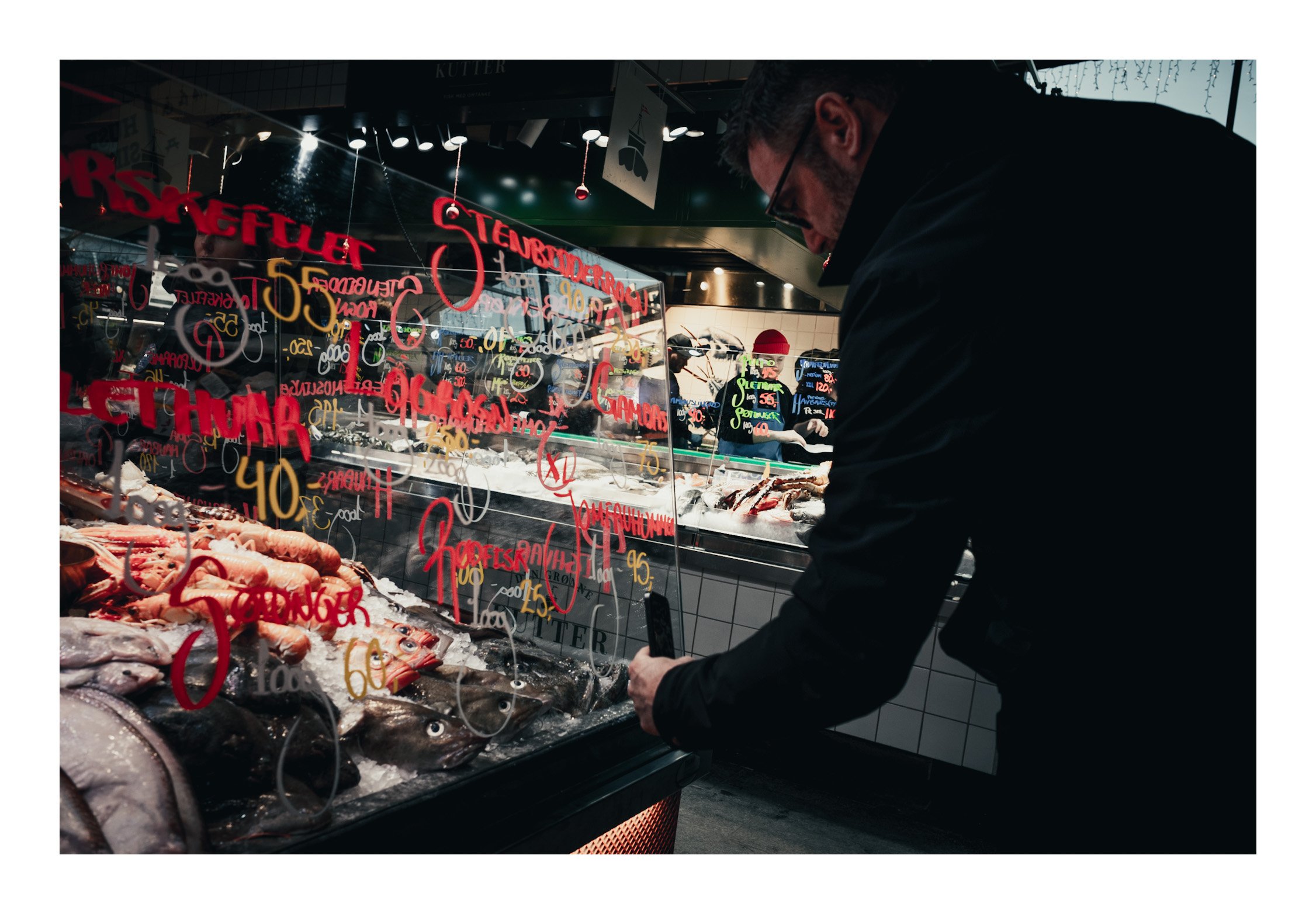 Someone stands at the fish counter in the food hall, pointing at the piece they want while the ice glistens with fresh seafood. The vendor smiles, lifts the fish, and explains where it came from. It feels authentic, lively, and full of the taste of t