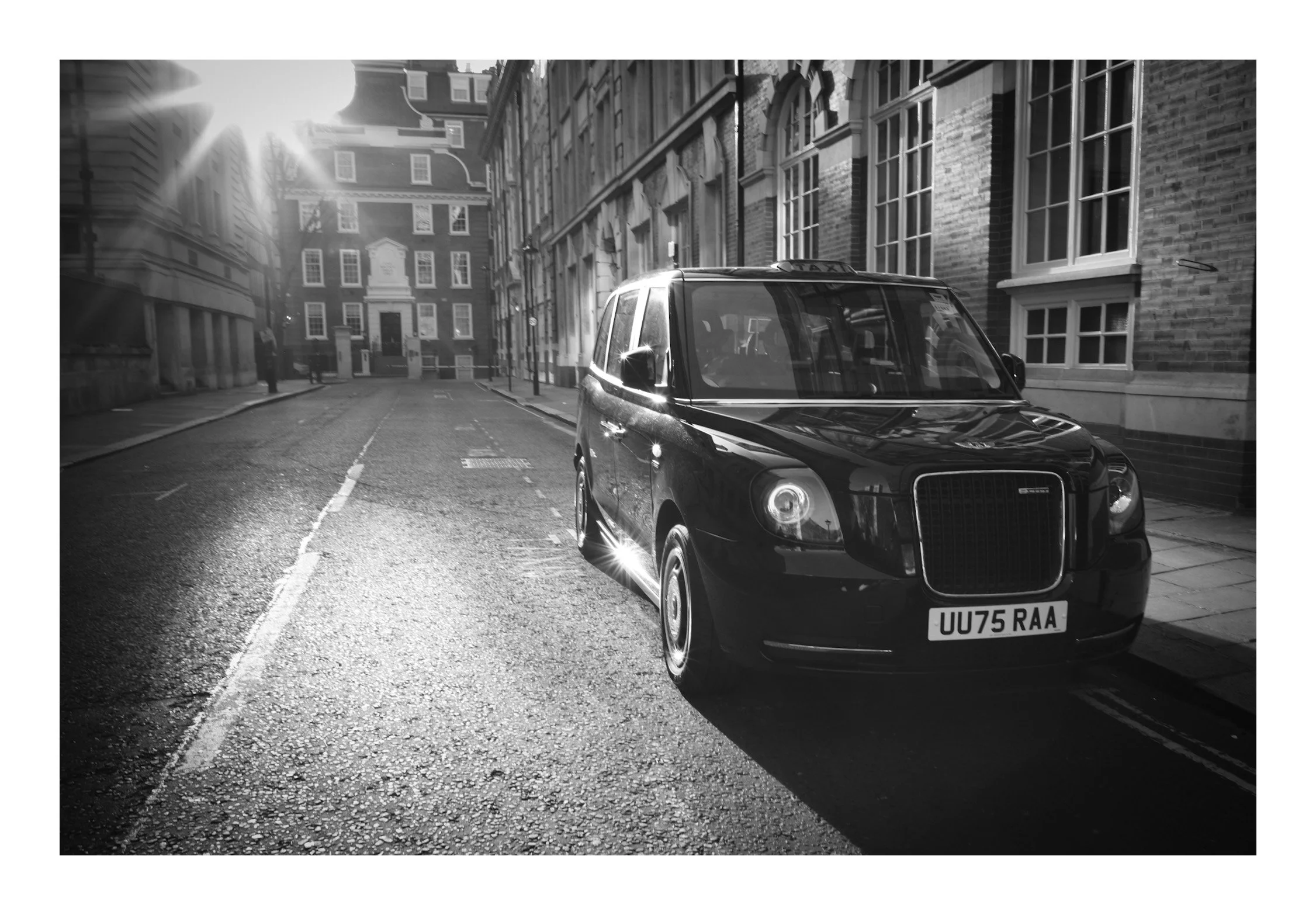 A classic black cab rolls through the streets—an enduring symbol of London’s character, tradition, and everyday movement.