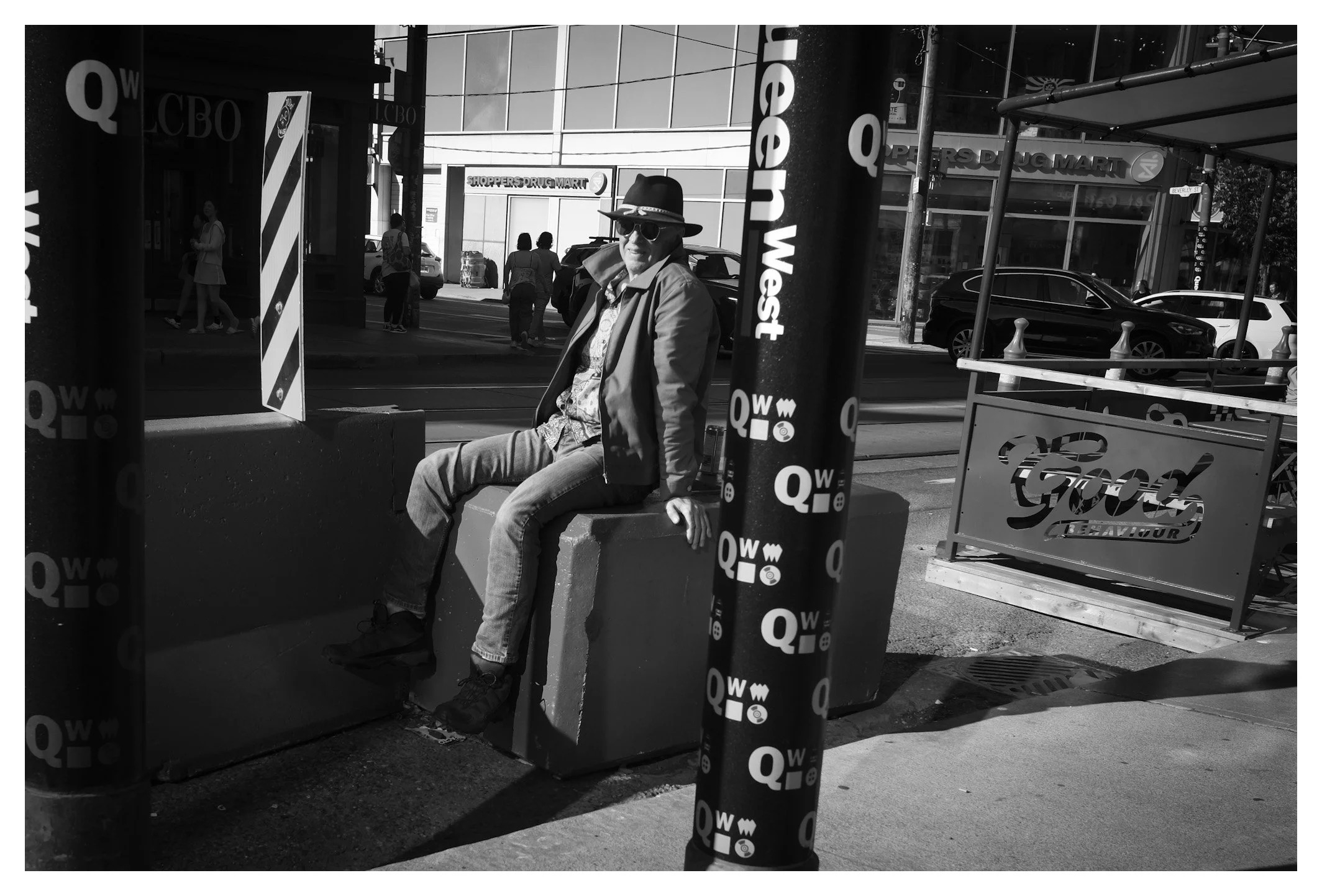Street photography is as much about presence as it is about people. Light, shadow, and a single glance can transform an ordinary corner into a memorable frame.