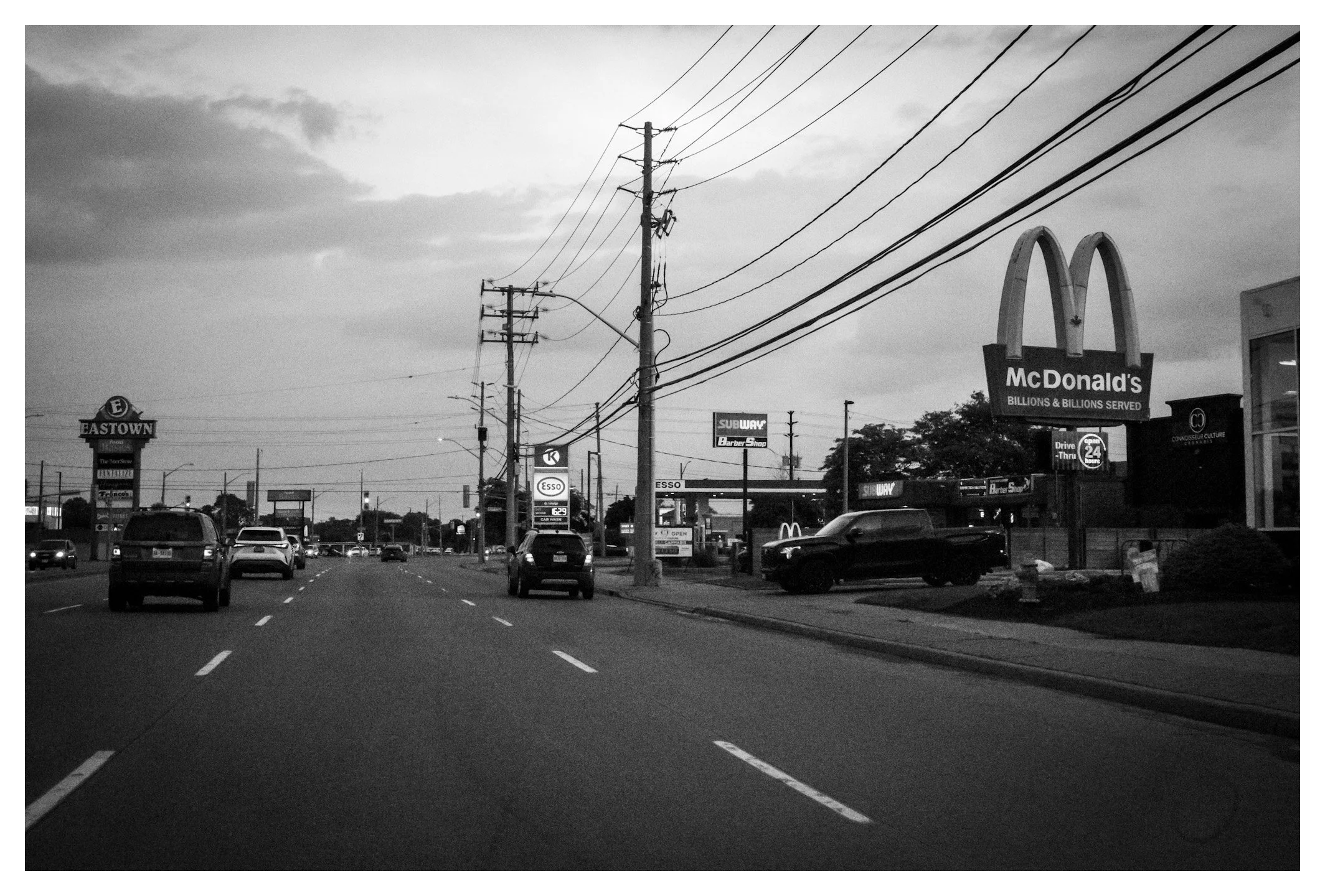 This roadside scene captures a quieter side of Detroit, where everyday life unfolds beyond the city's famous skyline. Sometimes, the journey between destinations tells the most authentic story.