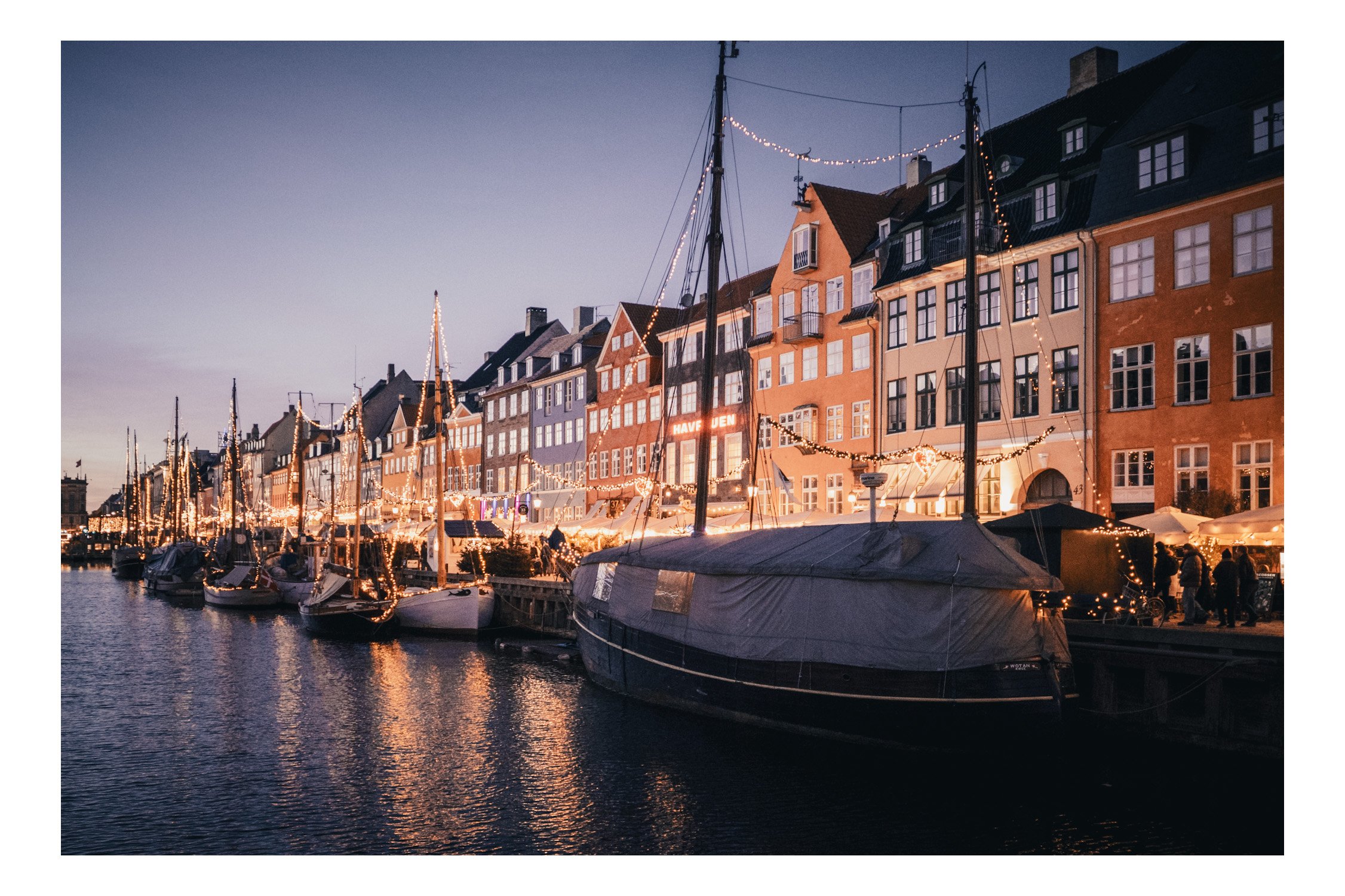 Nyhavn is Copenhagen’s most iconic waterfront, lined with colorful 17th-century townhouses and lively cafés. Once a busy commercial port, it’s now a beautiful place to stroll, sit by the water, and watch the boats. At sunset, the atmosphere becomes e
