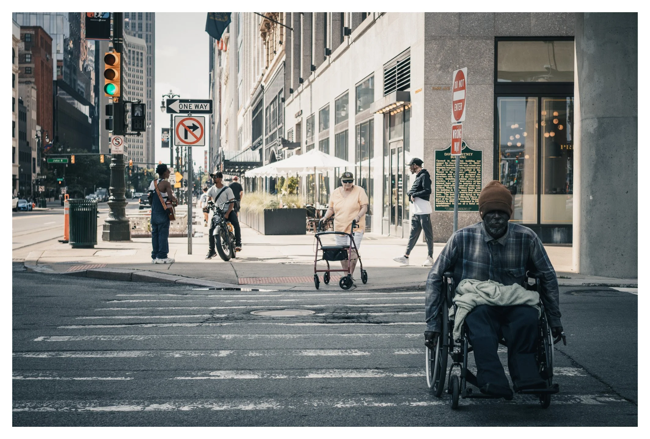 This street scene captures the many faces of Detroit, where every corner tells a different story. Beyond its iconic landmarks, the city's true character is found in the people who shape its everyday life.