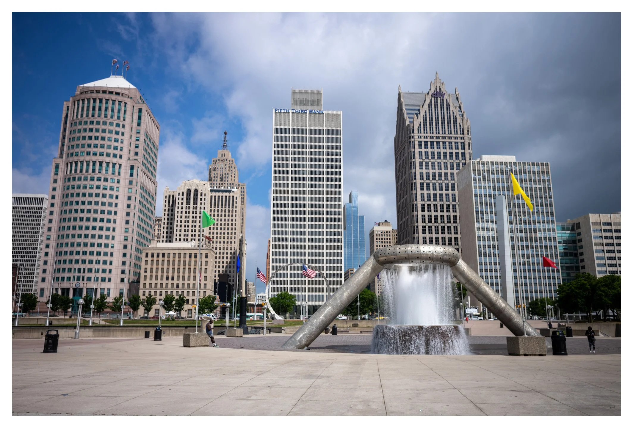 Detroit's skyline blends historic skyscrapers with modern architecture, reflecting the city's rich industrial heritage and ongoing transformation. Standing beneath the iconic Spirit of Detroit, you can truly feel the resilience and energy that define