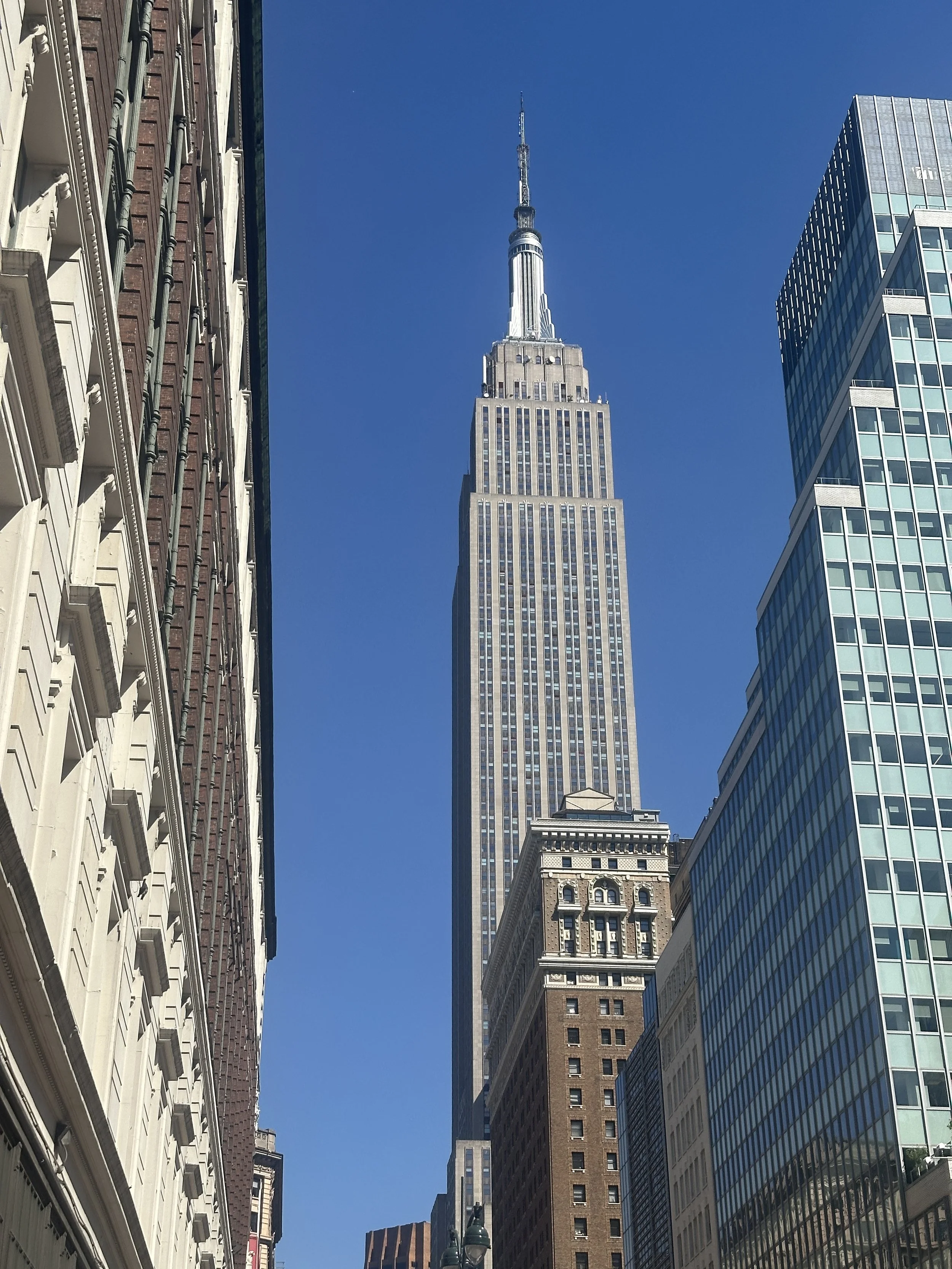 The Empire State Building rises above New York City as a symbol of ambition and classic architecture.
Its Art Deco design and towering presence define the city’s iconic skyline.
From every angle, it represents the spirit, scale, and history of New Yo