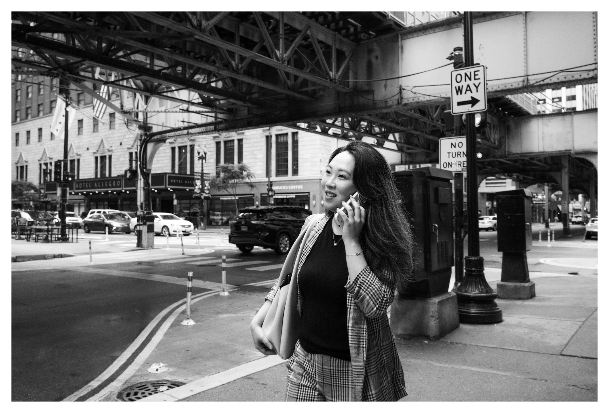 The historic "L" tracks provide the backdrop for another ordinary moment in downtown Chicago. A simple scene that reflects the city's unmistakable character.