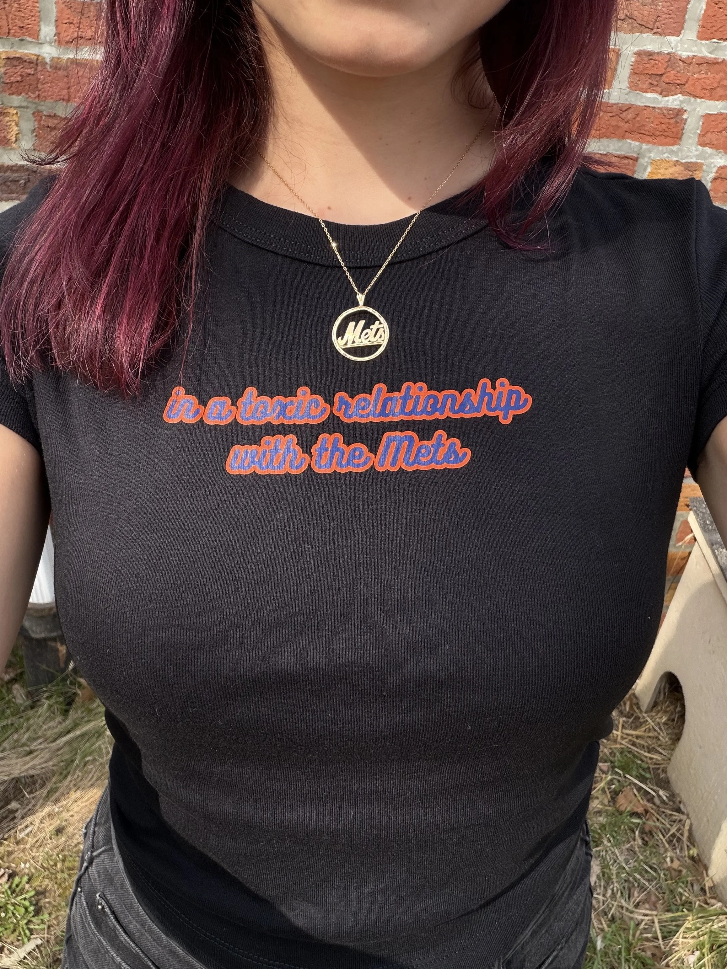 "In a Toxic Relationship with the Mets" Black Baby Tee