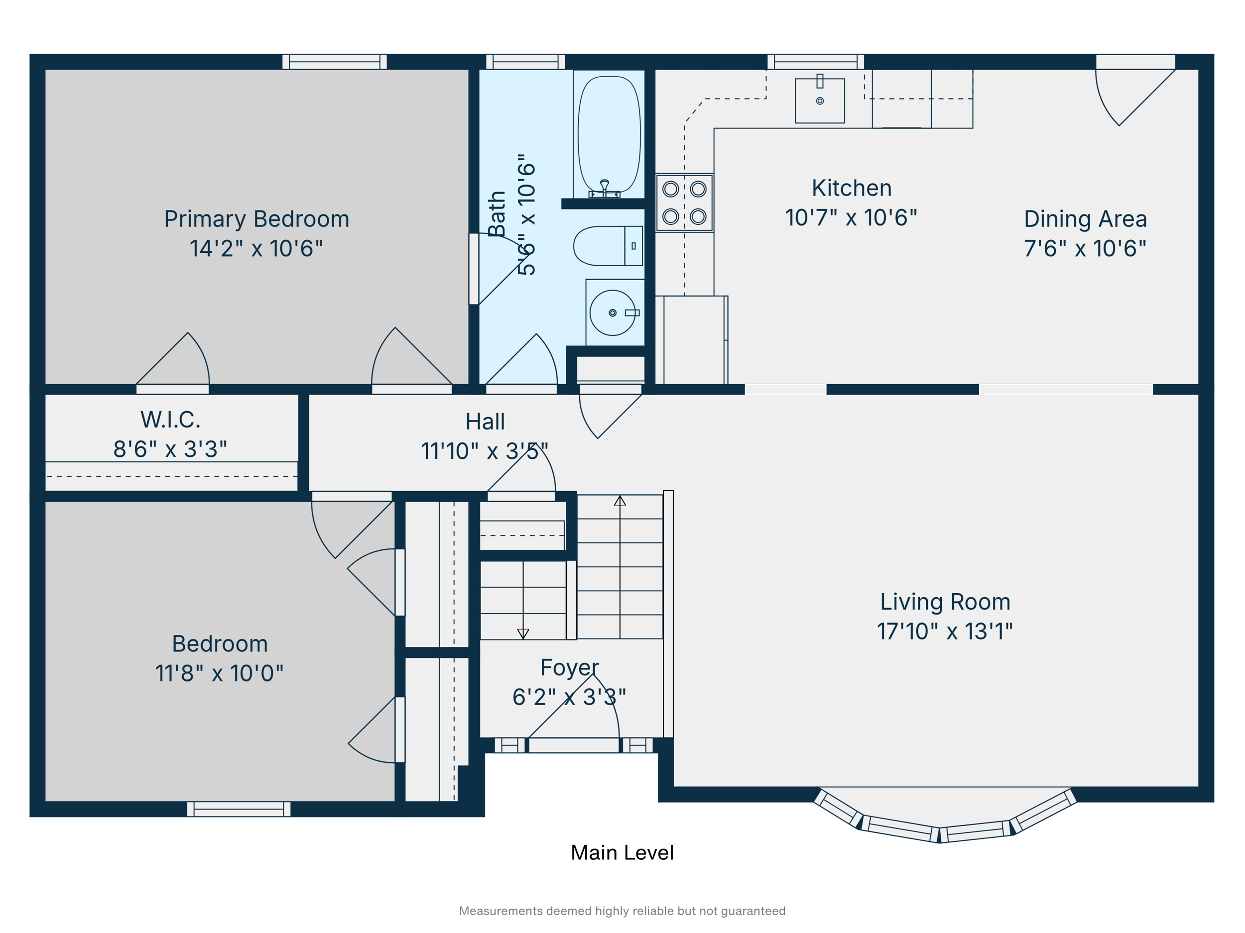 Floor plan of a main level home layout showing a primary bedroom, bedroom, two bathrooms, kitchen, dining area, living room, hall, foyer, and walk-in closet.