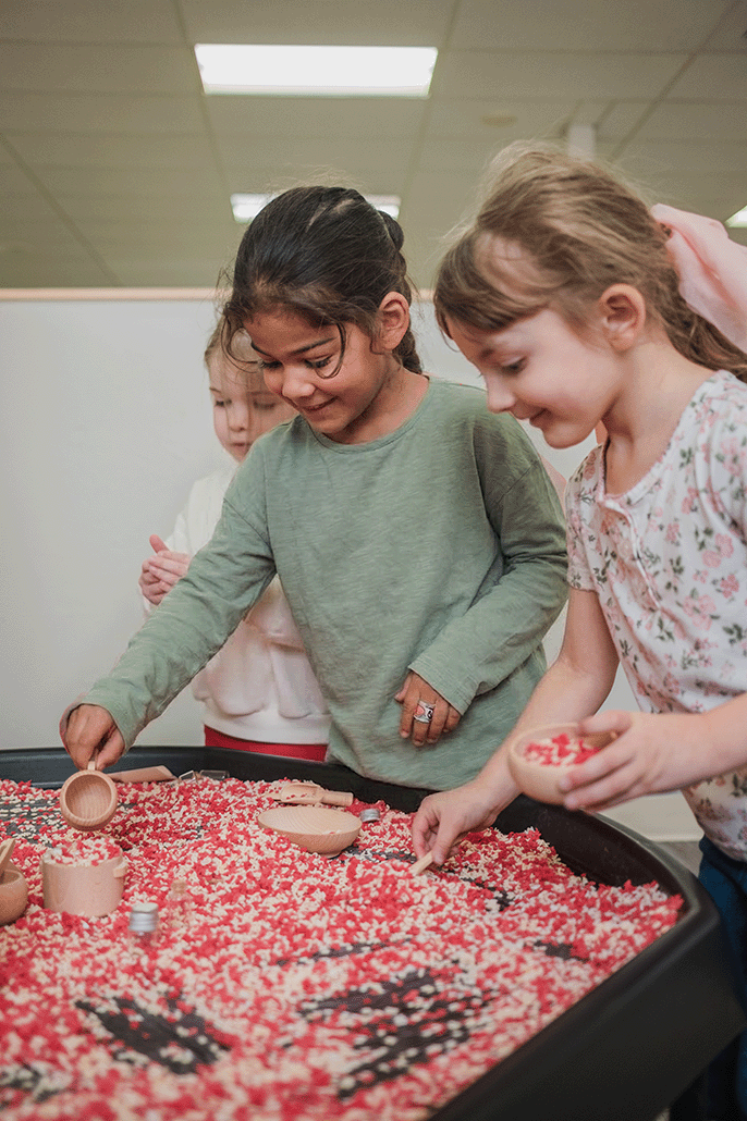 Children engaged in hands-on Executive Function sensory play at A Good Time Out preschool in Bakersfield, CA.
