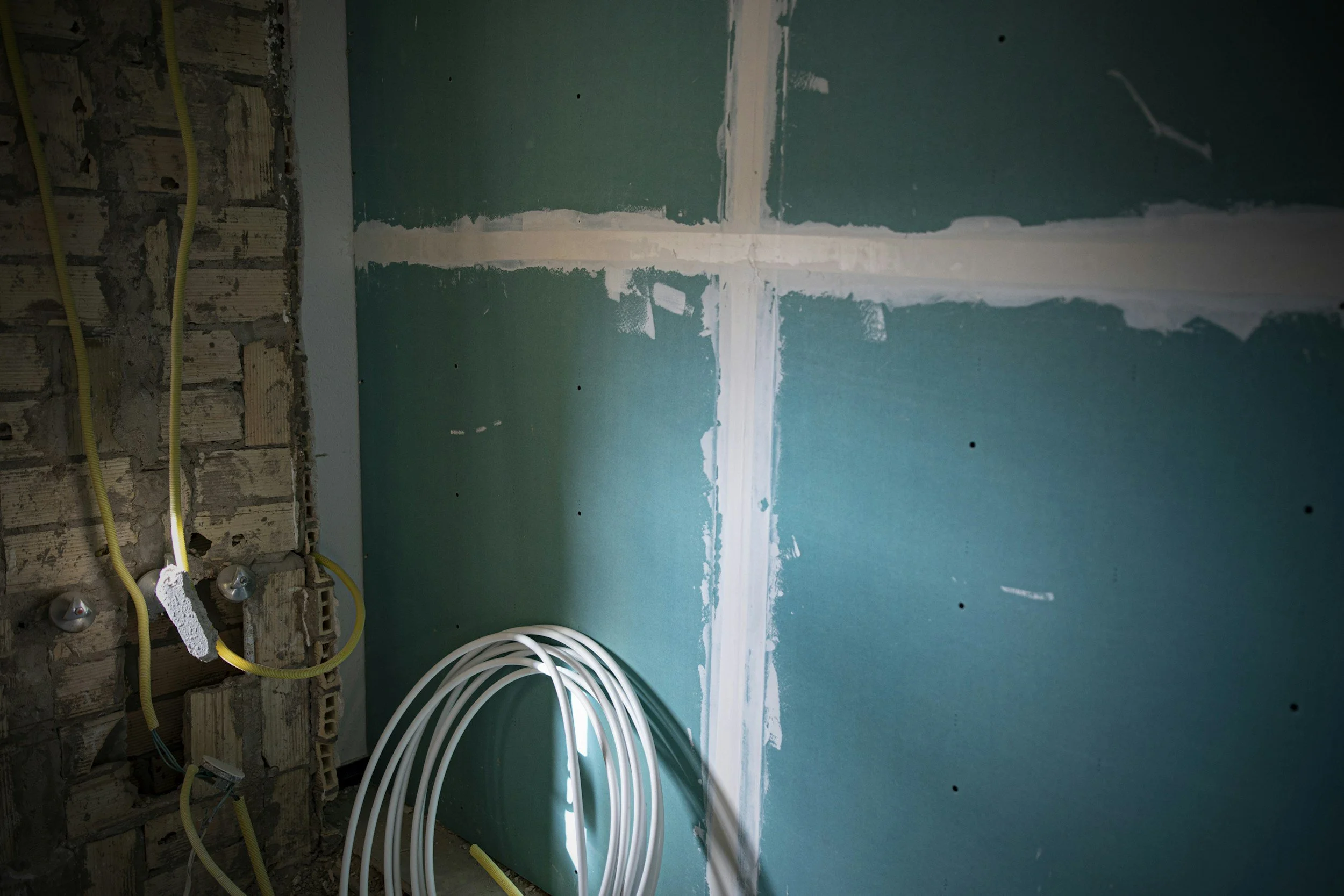 Interior property restoration project showing drywall repair and reconstruction in the Chicagoland area.