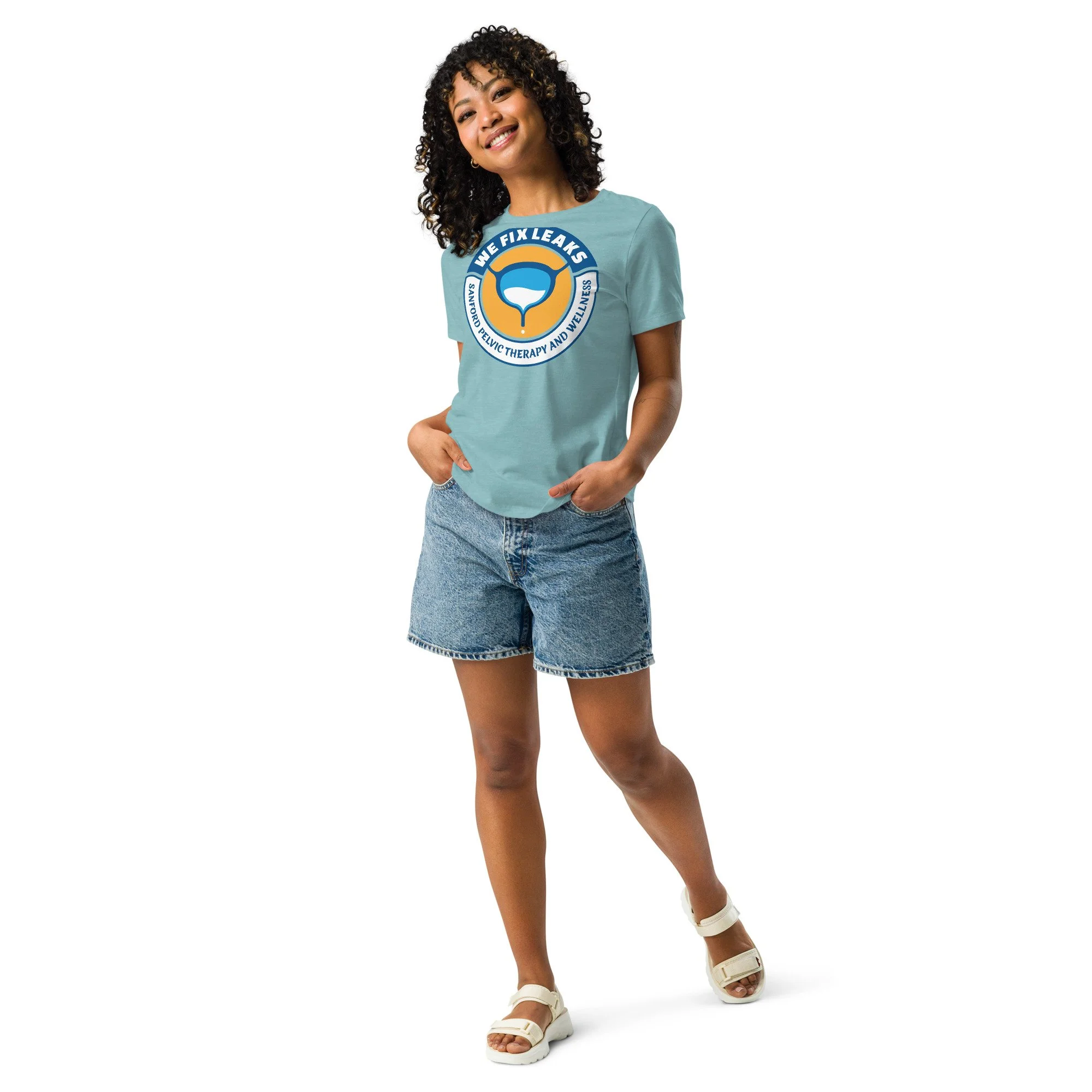 Woman wearing the We Fix Leaks, women's heather blue lagoon colored t-shirt.