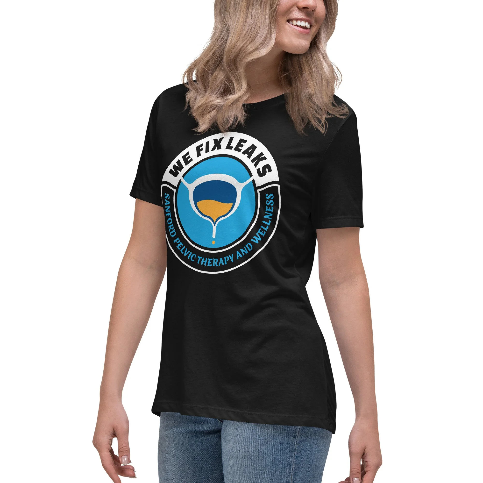 Woman wearing the We Fix Leaks, women's black colored t-shirt.