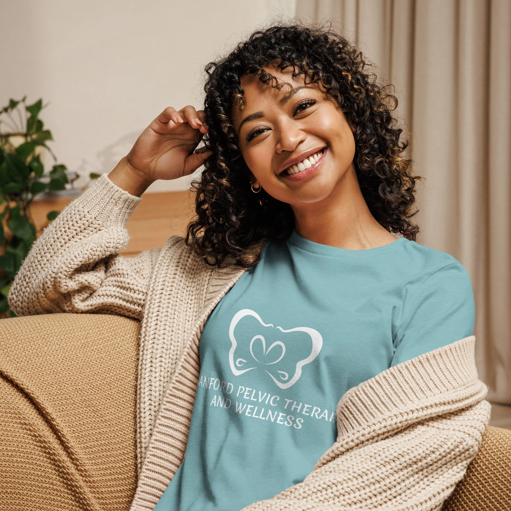Sanford Pelvic Therapy and Wellness logo on a women's heather blue lagoon colored t-shirt.