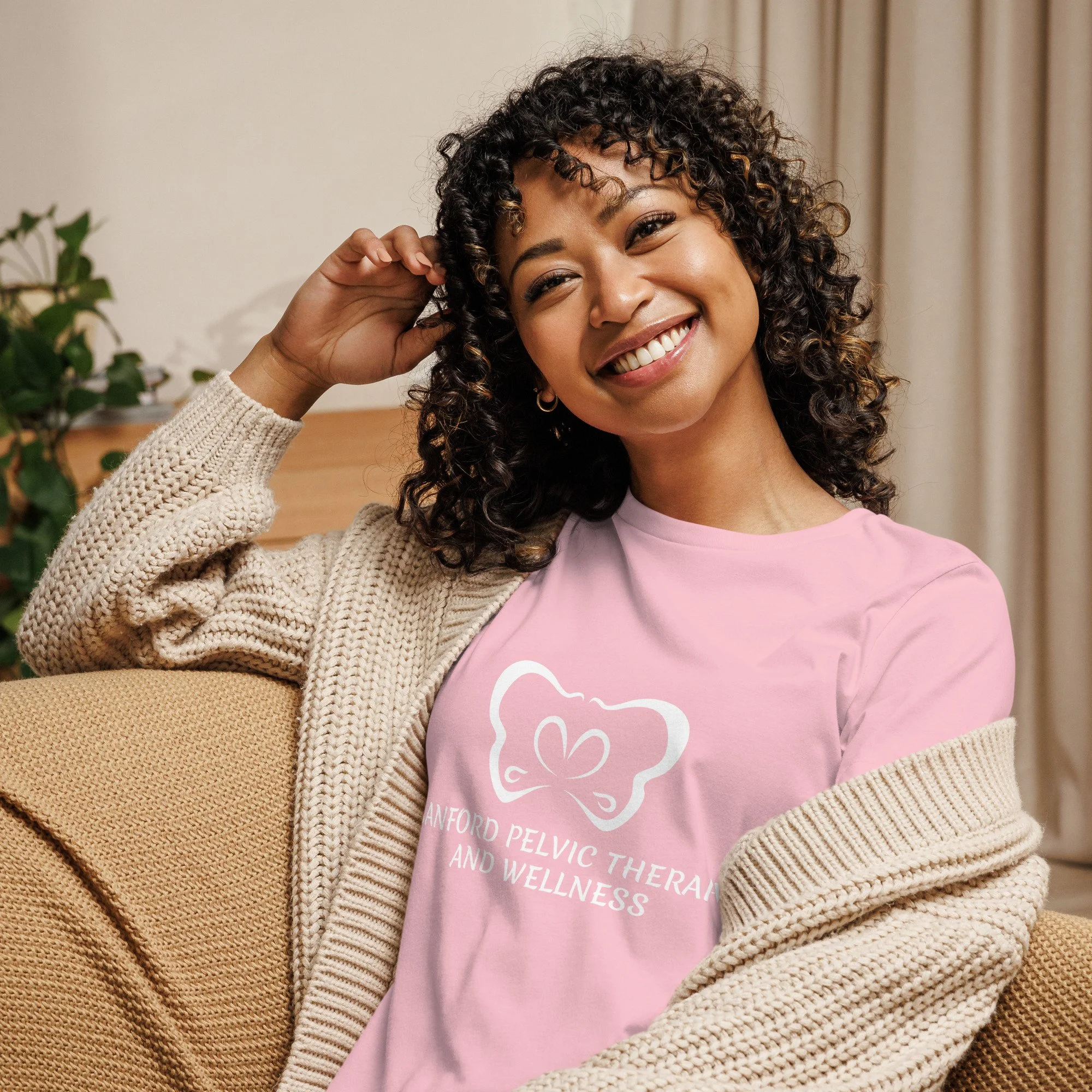 Sanford Pelvic Therapy and Wellness logo on a women's pink colored t-shirt.