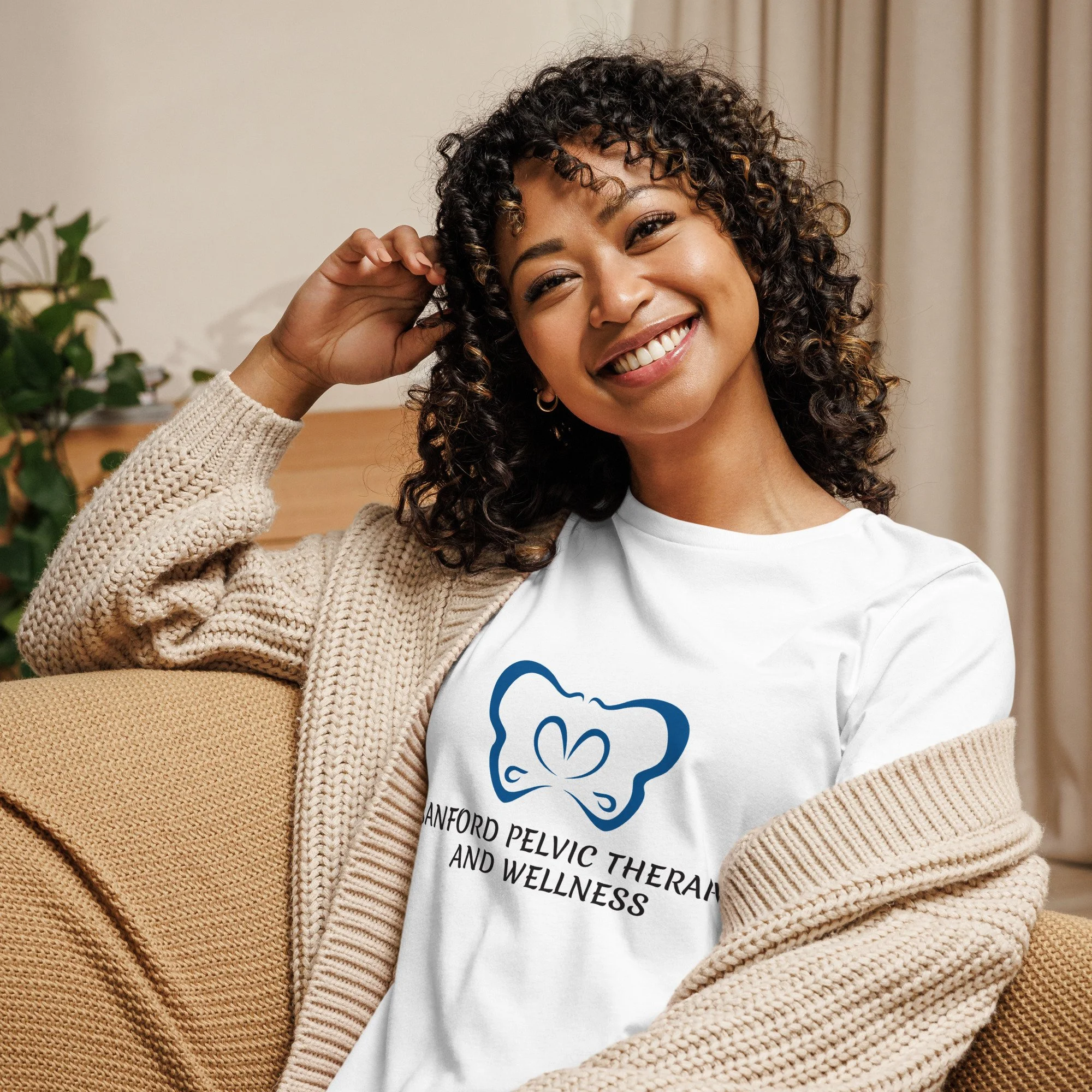 Sanford Pelvic Therapy and Wellness logo on a women's white colored t-shirt.