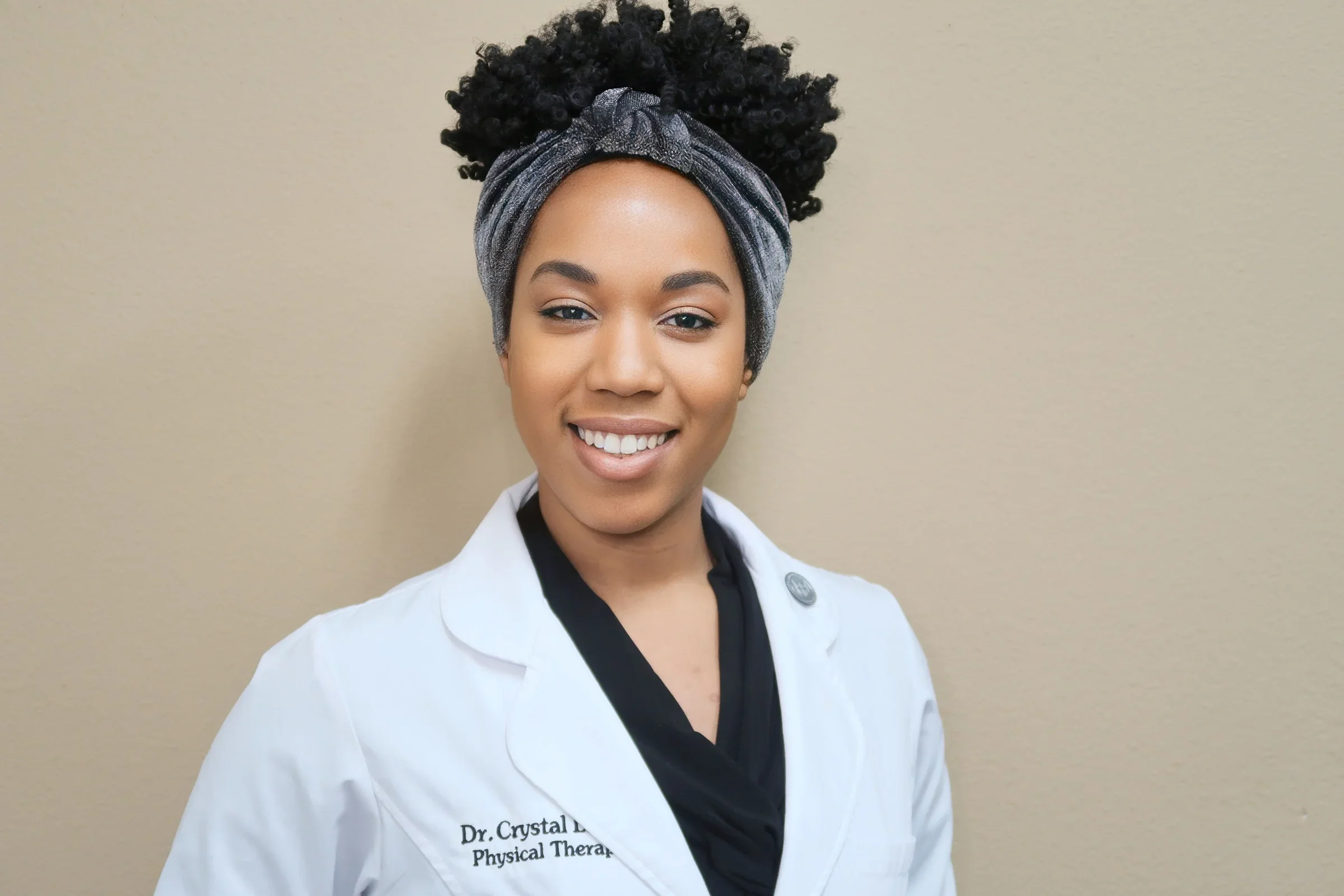 Crystal Laidley in a lab coat.