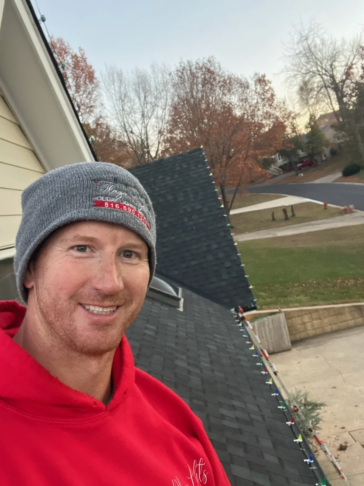 Christmas Light Installer on a roof