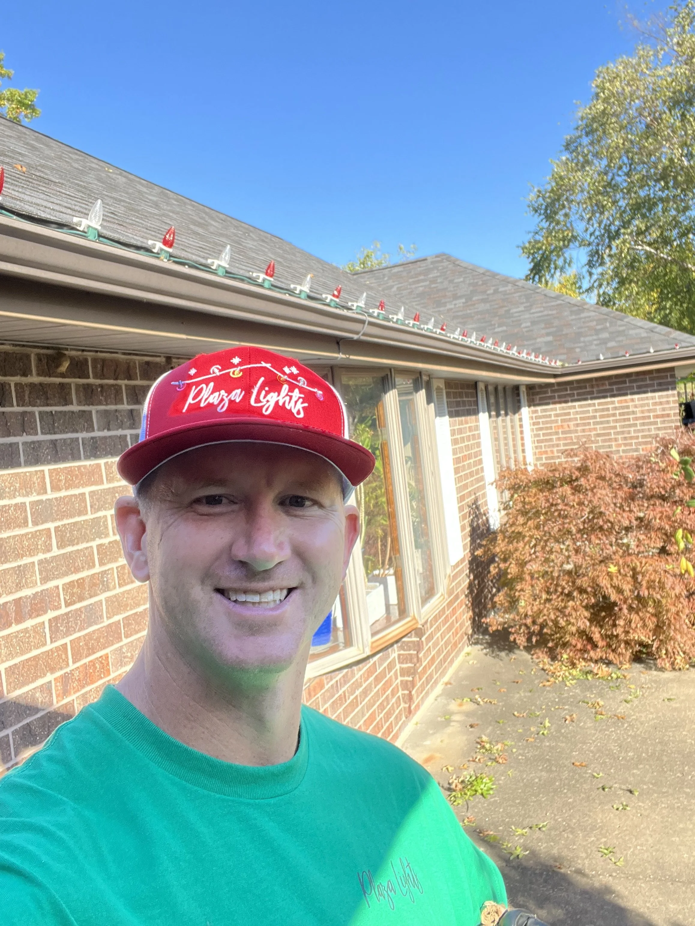 Crew installing Christmas Lights in Johnson County Kansas Plaza Lights Shawnee Kansas