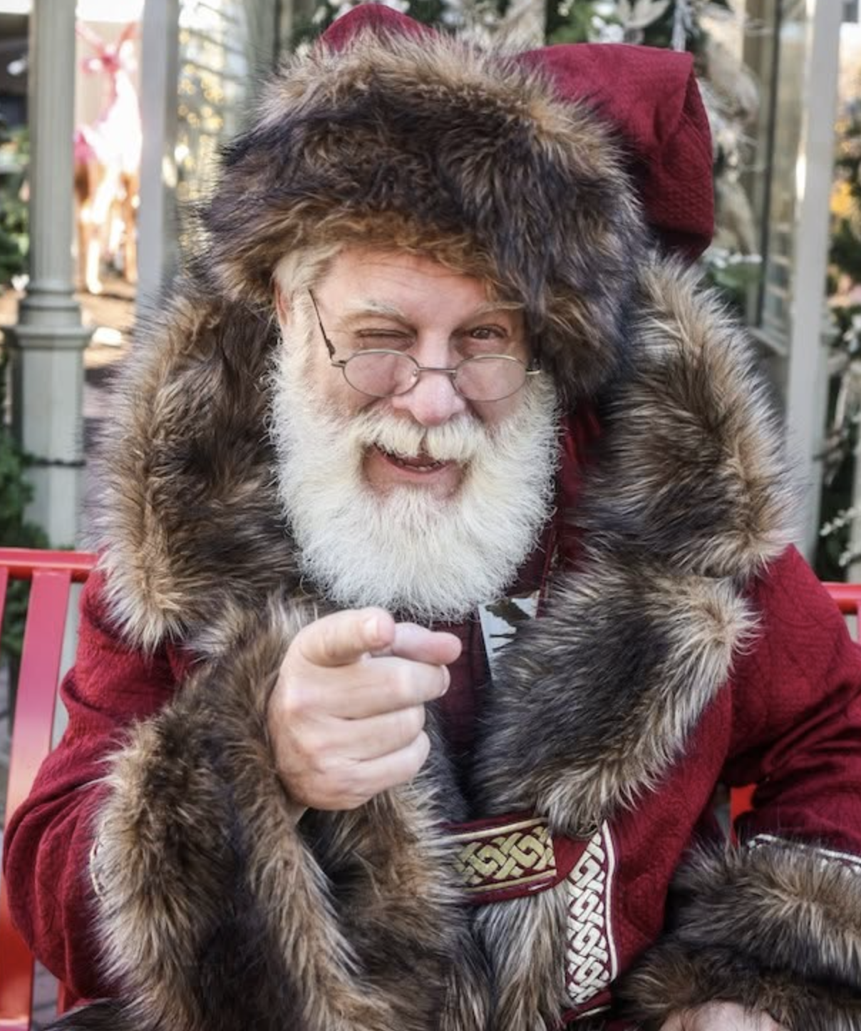 Live Santa pointing and winking at the camera