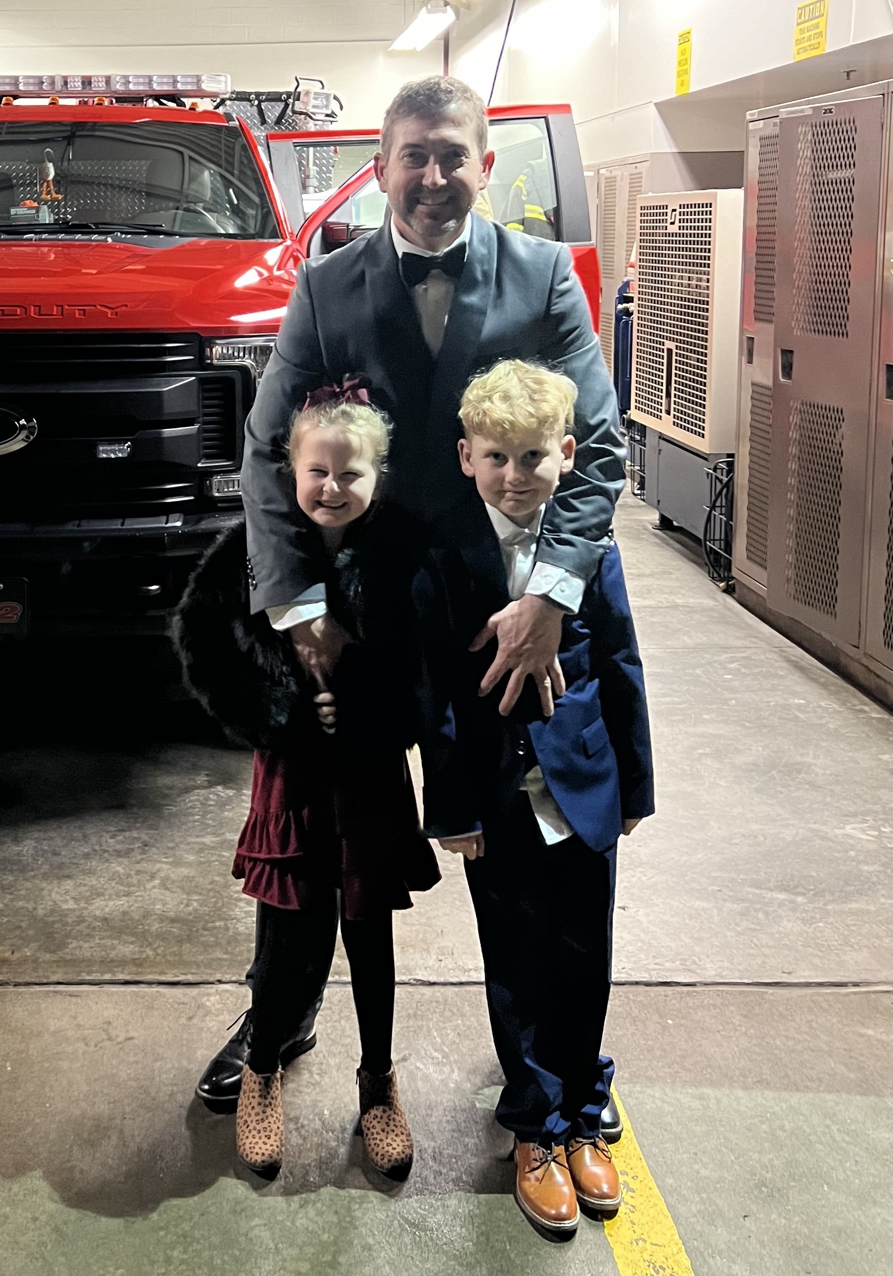 Dustin with kids at fire station