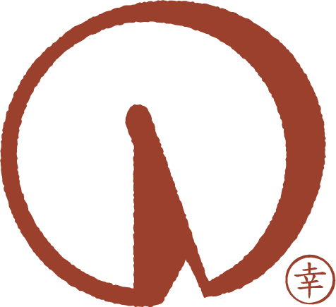 A stylized logo with a brown circle and a brown pen or brush inside, with Asian characters in a small circle at the bottom right.