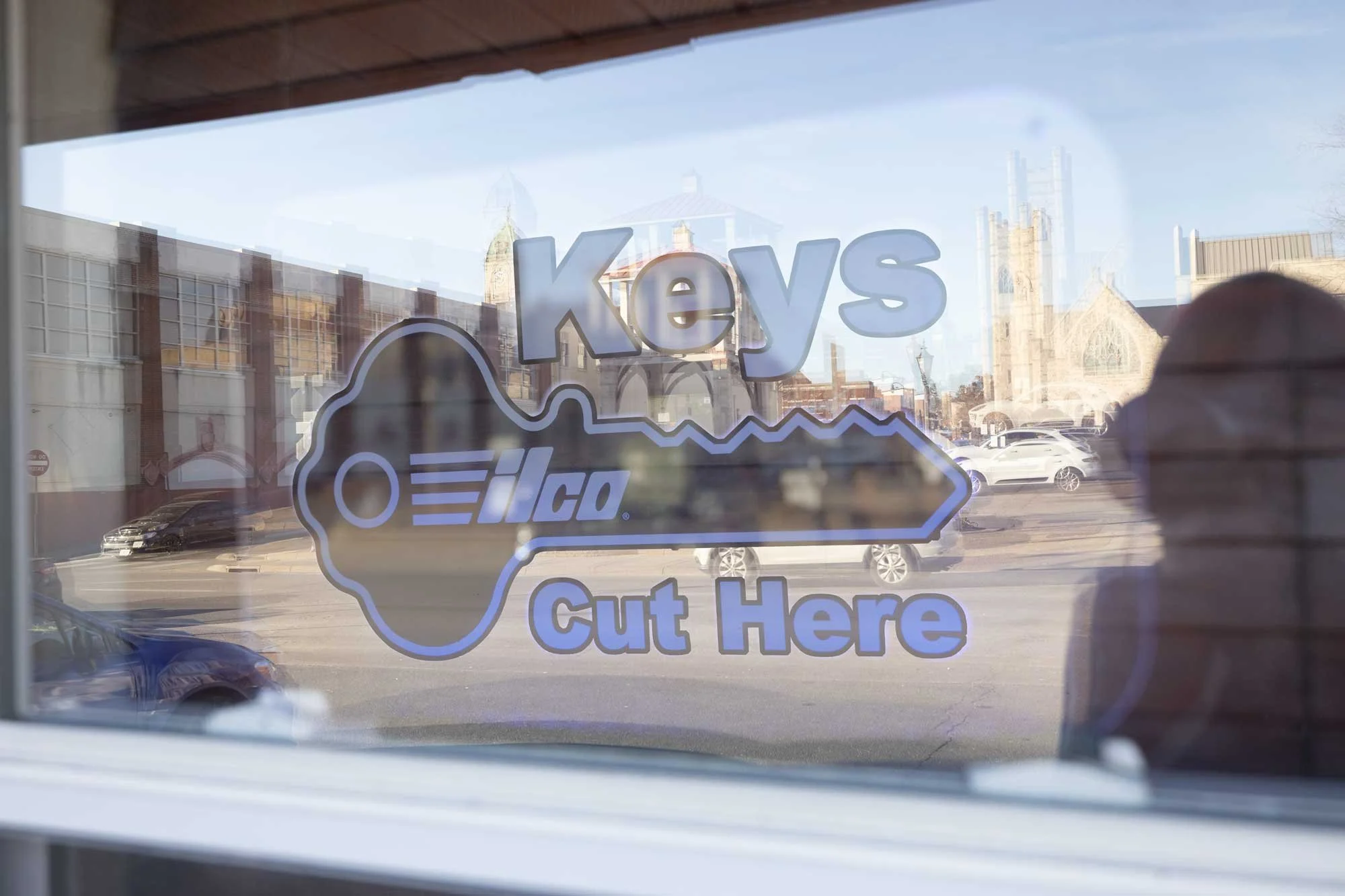 B.C. Lox and Keys storefront in Harrisonburg VA with Keys Cut Here window sign for fast key duplication and locksmith service.