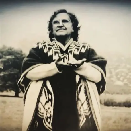 Sara Vasquez, Mother Sarita, standing in traditional Hispanic wool covering