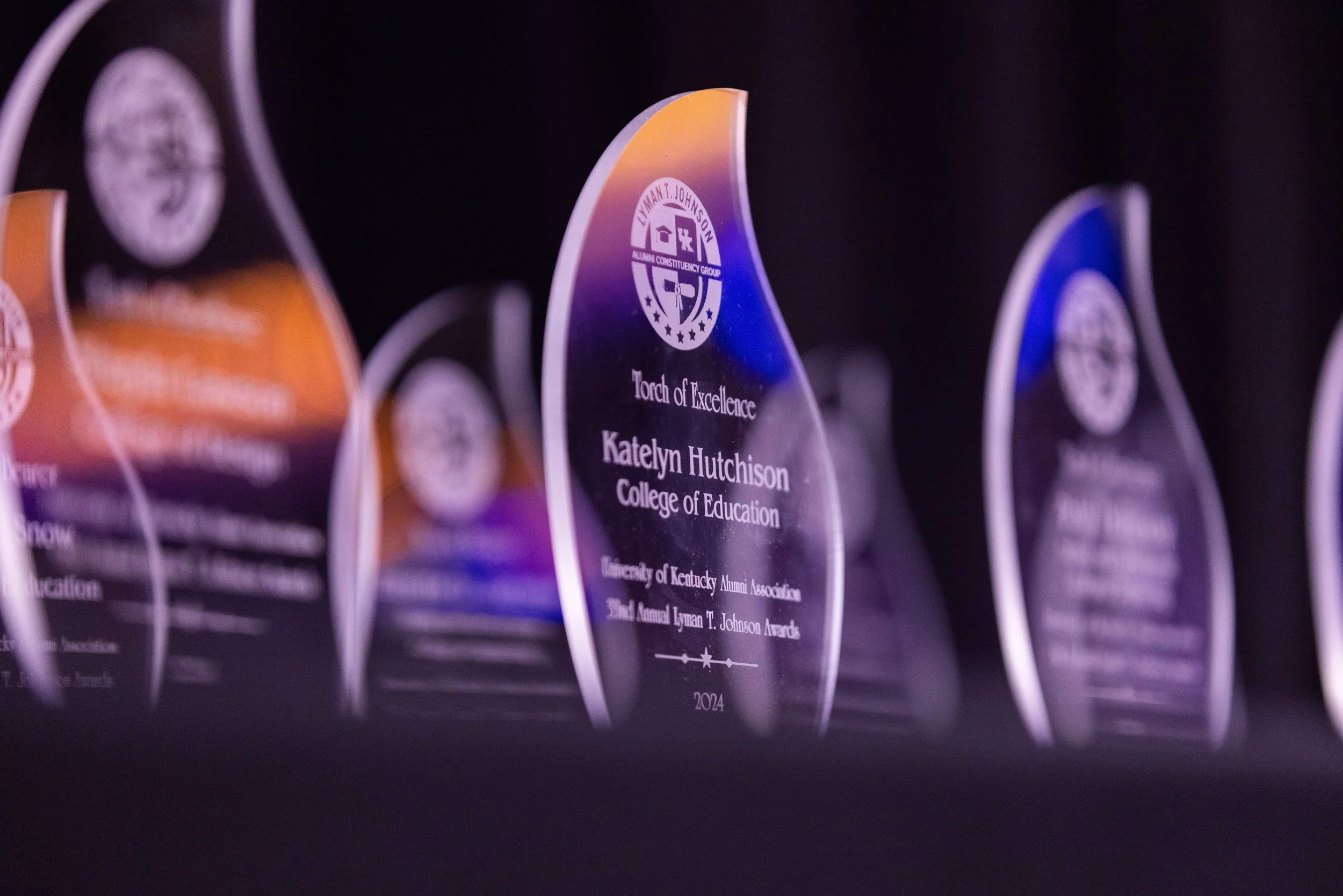 Close-up of crystal Lyman T. Johnson Awards at the UKY Gatton Student Center, featuring the 2024 College of Education recipient, photographed by 859 Photography.
