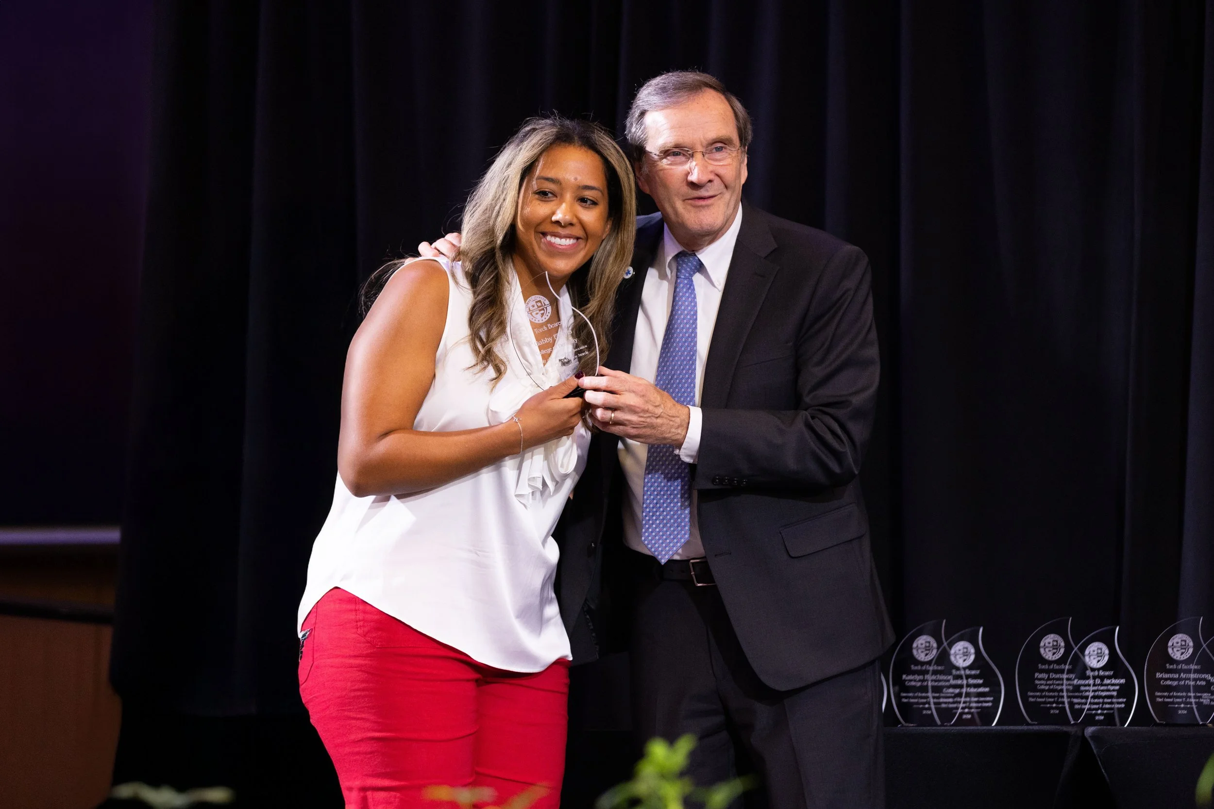 Award presentation on stage at the Gatton Student Center Ballroom, featuring professional event photography and formal ceremony coverage by 859 Photography.
