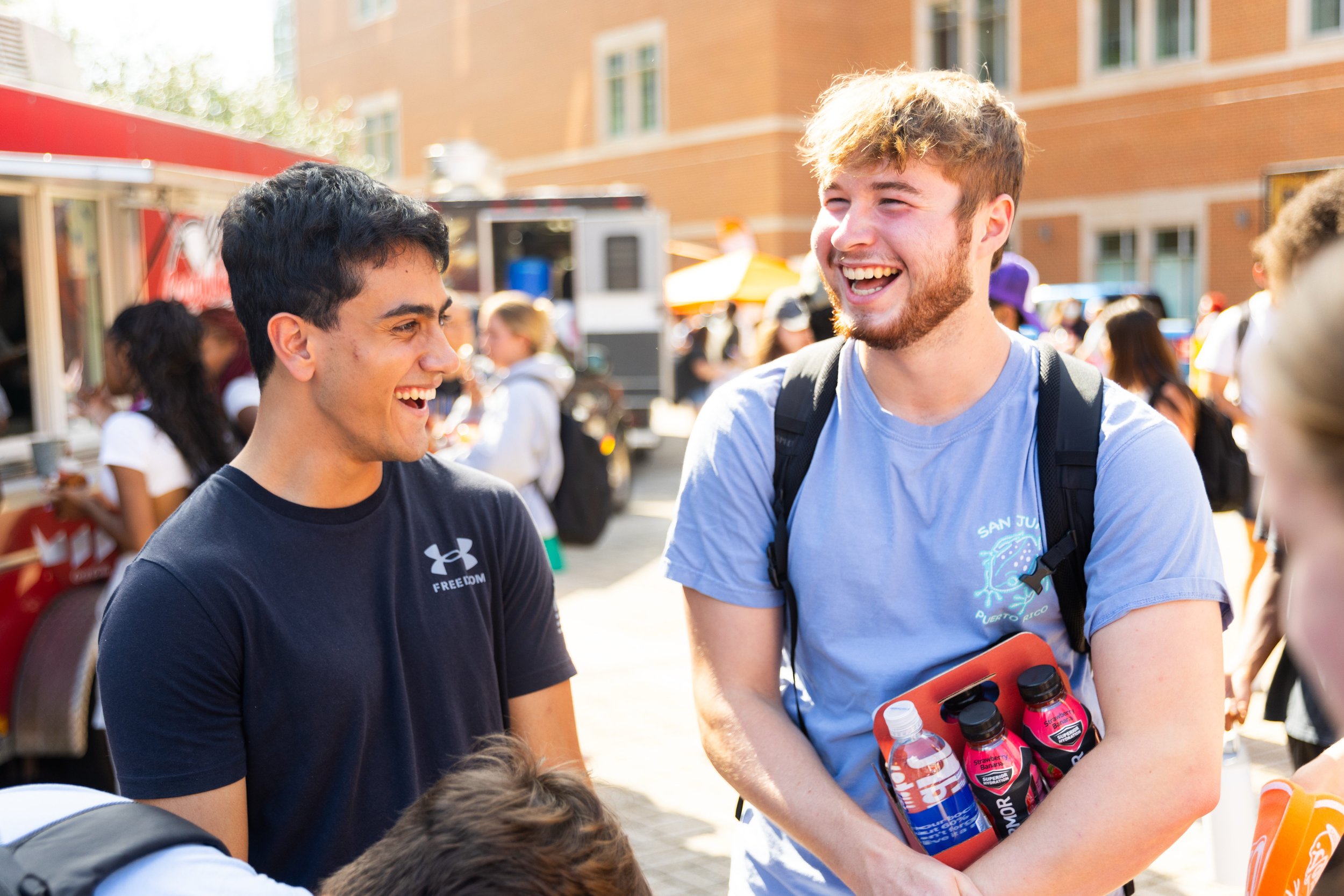 Candid lifestyle photography of attendees enjoying an outdoor food truck festival in Lexington, KY, captured by professional event photographer 859 Photography.