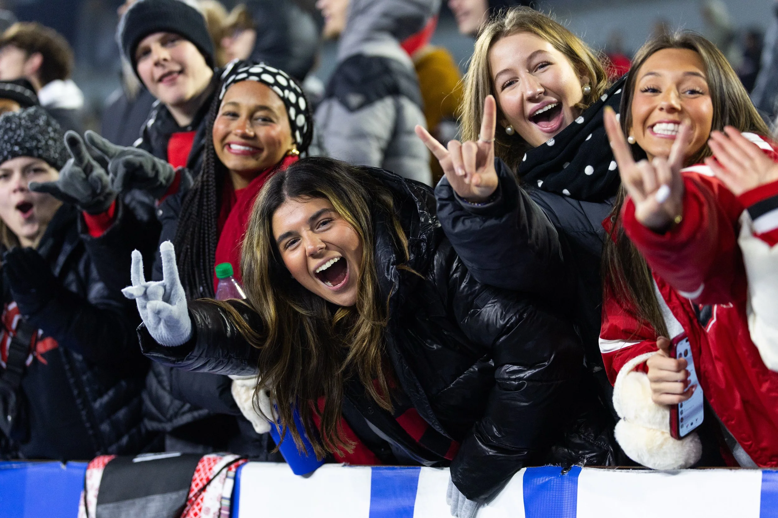 Excited fans cheering at the KHSAA High School Football State Championships at Kroger Field, featuring candid crowd and sports event photography by 859 Photography.