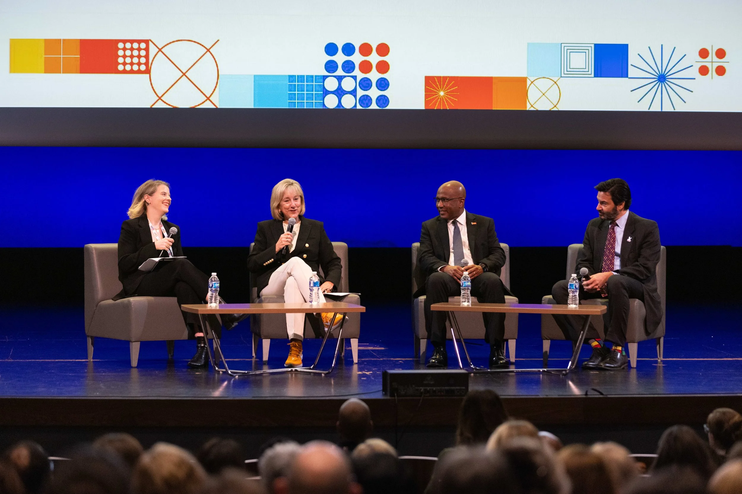 Professional panel discussion at the Central Bank Center in Lexington, KY, featuring a digital backdrop and live event photography by 859 Photography.