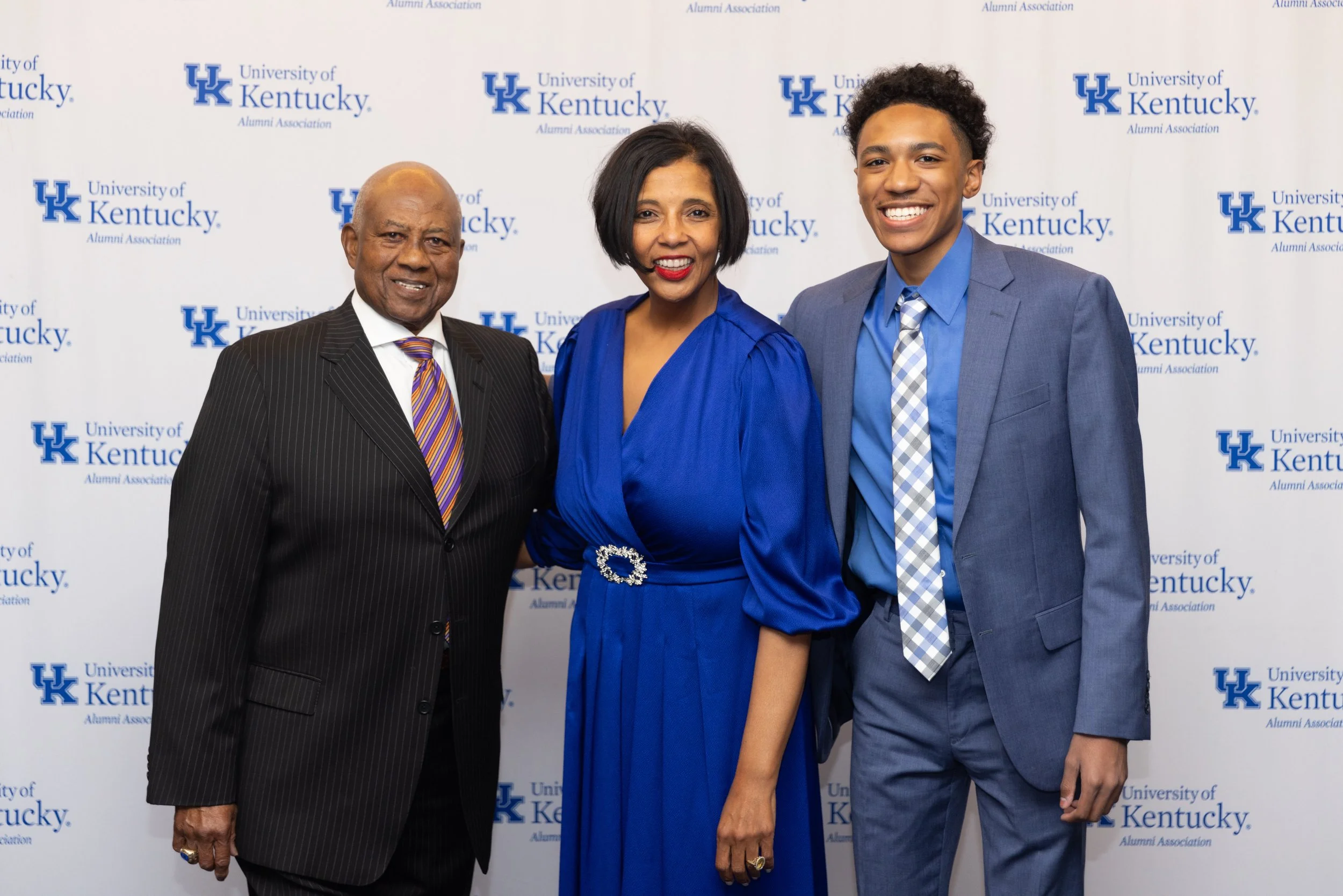 Formal group portrait in front of a University of Kentucky backdrop at The Campbell House Lexington, captured by professional event photographer 859 Photography.