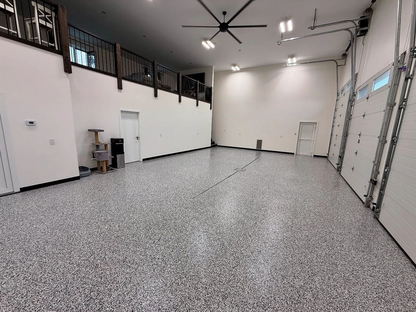 Just under 1000sq ft of domino flake for this shop house garage. 

Client needed to keep the dust down from it constantly tracking into the house which is common with bare concrete. This system provides that. 

Message me for a quote today!

#GarageE
