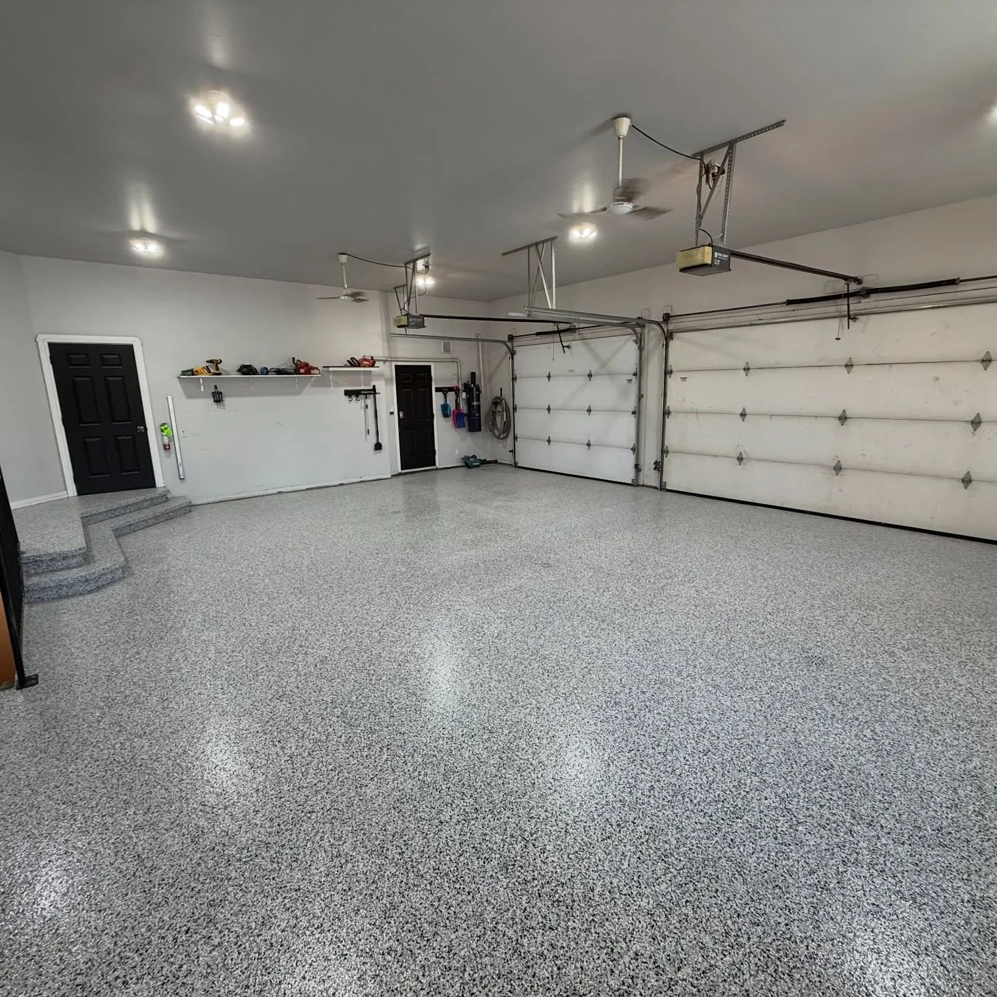 The last Powerhouse transformation of 2025. 

This slab had major spalling on two big areas and some serious crack repair that had to get mended before we covered it with this CUSTOM flake blend. 

The two wooden landings were a project of their own.