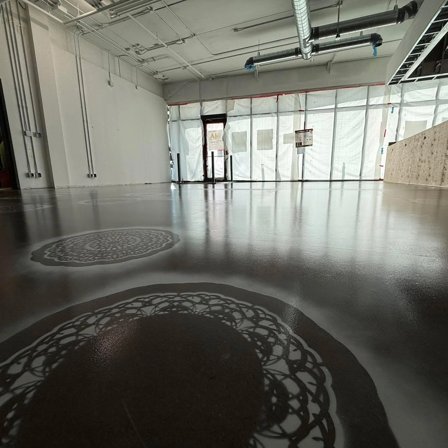 Just wrapped up two restaurant floors in Winnipeg. 

Here is House of Ma - clear epoxy to keep that natural concrete look, with custom stencils layered in to go with the theme of the space

Finished with a matte, high-wear urethane topcoat for easy m