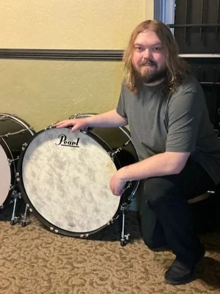 Photo of Seth Gottberg with a bass drum